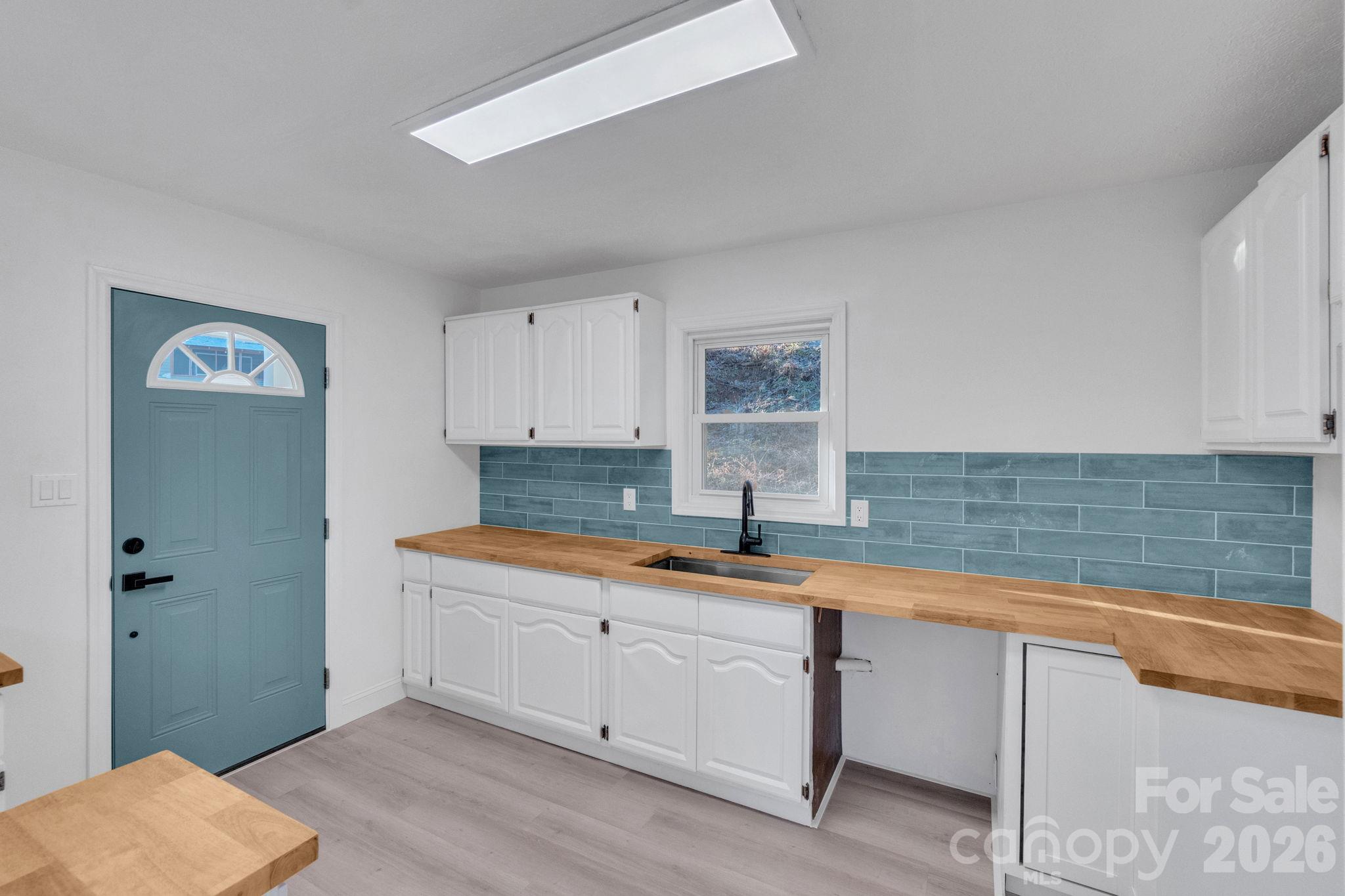 Enter the remodeled kitchen. Picture taken prior to the installation of the dishwasher. - 49 Livingston Street, Tryon