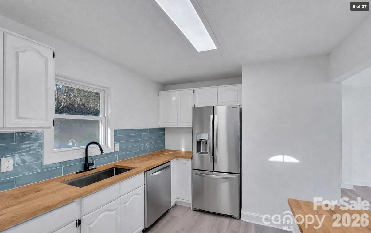 Bright kitchen with butcher block counters. - 49 Livingston Street, Tryon