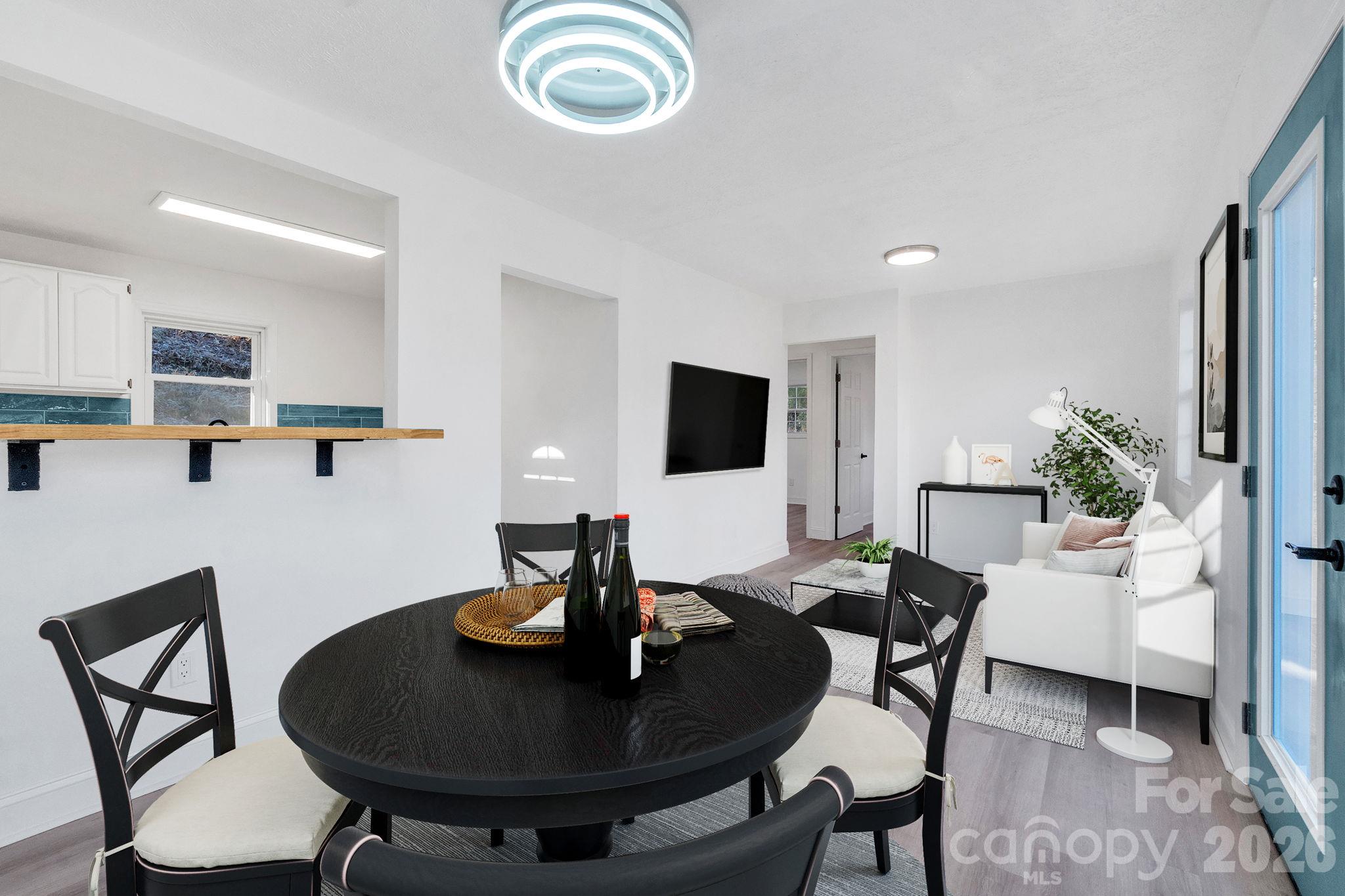 Virtually staged dining and living spaces. - 49 Livingston Street, Tryon