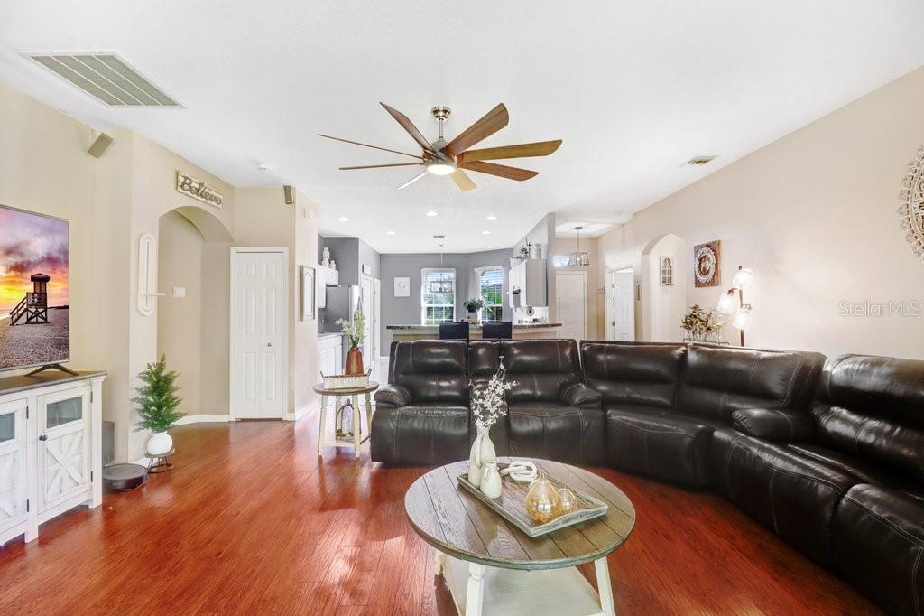 Living room with view into kitchen - 3876 WHISTLEWOOD CIR, LAKELAND