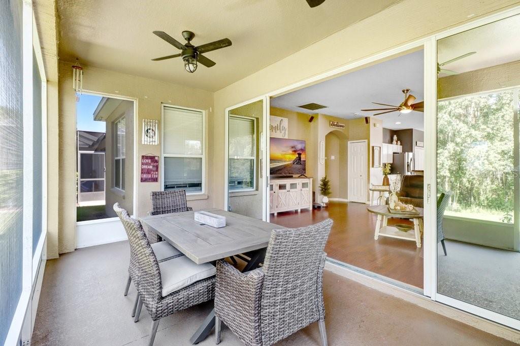 Screened lanai with view to living room - 3876 WHISTLEWOOD CIR, LAKELAND