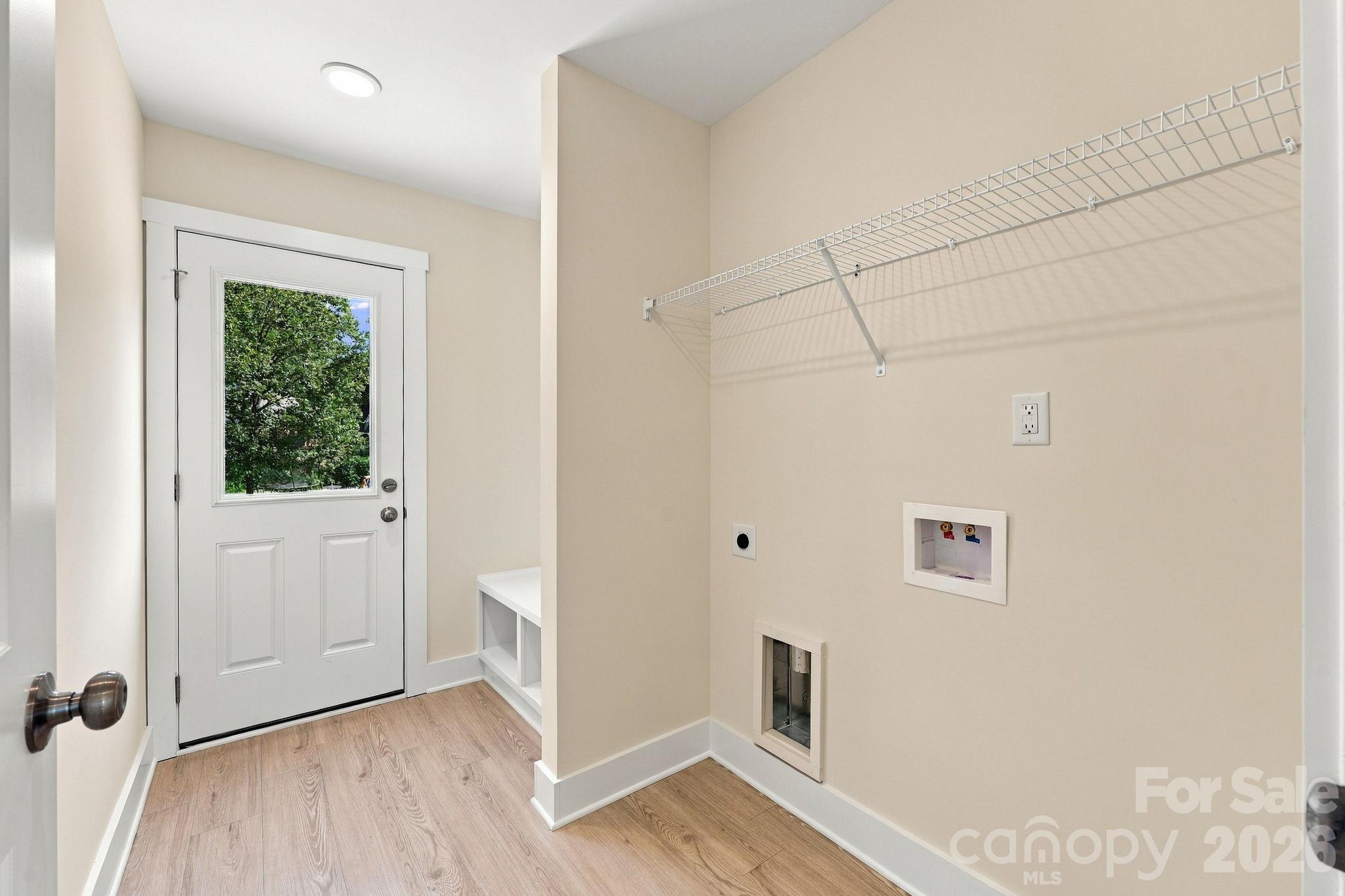 Laundry Room with exit to back patio. - 808 4th Street, Albemarle
