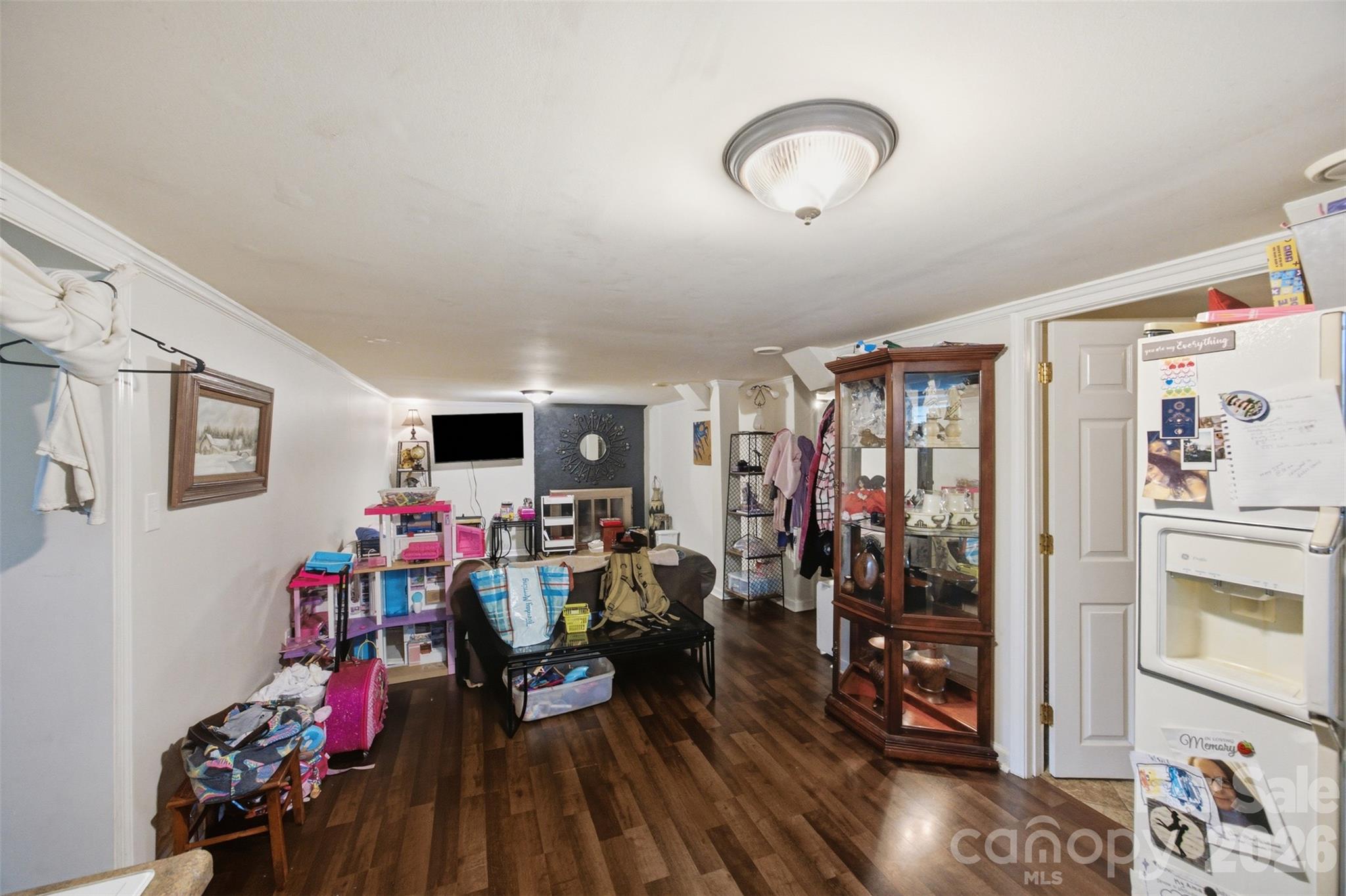 Downstairs den area looking from kitchen side. Ceiling is under 7 Feet. - 146 Duck Cove Road, Belmont