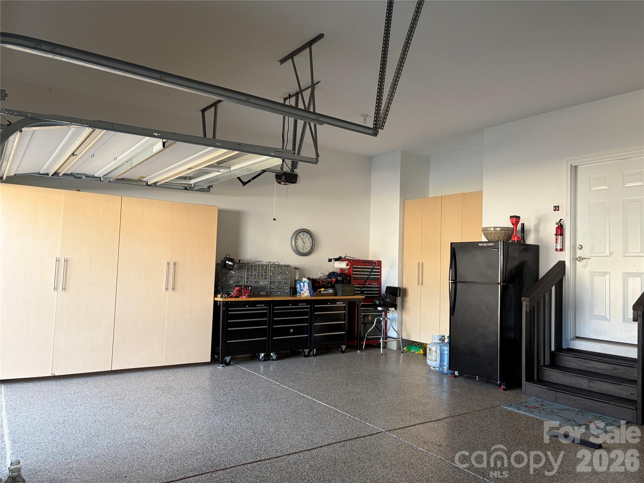 3-car garage with epoxy floors and storage cabinets - 1567 Tranquility Boulevard, Lancaster