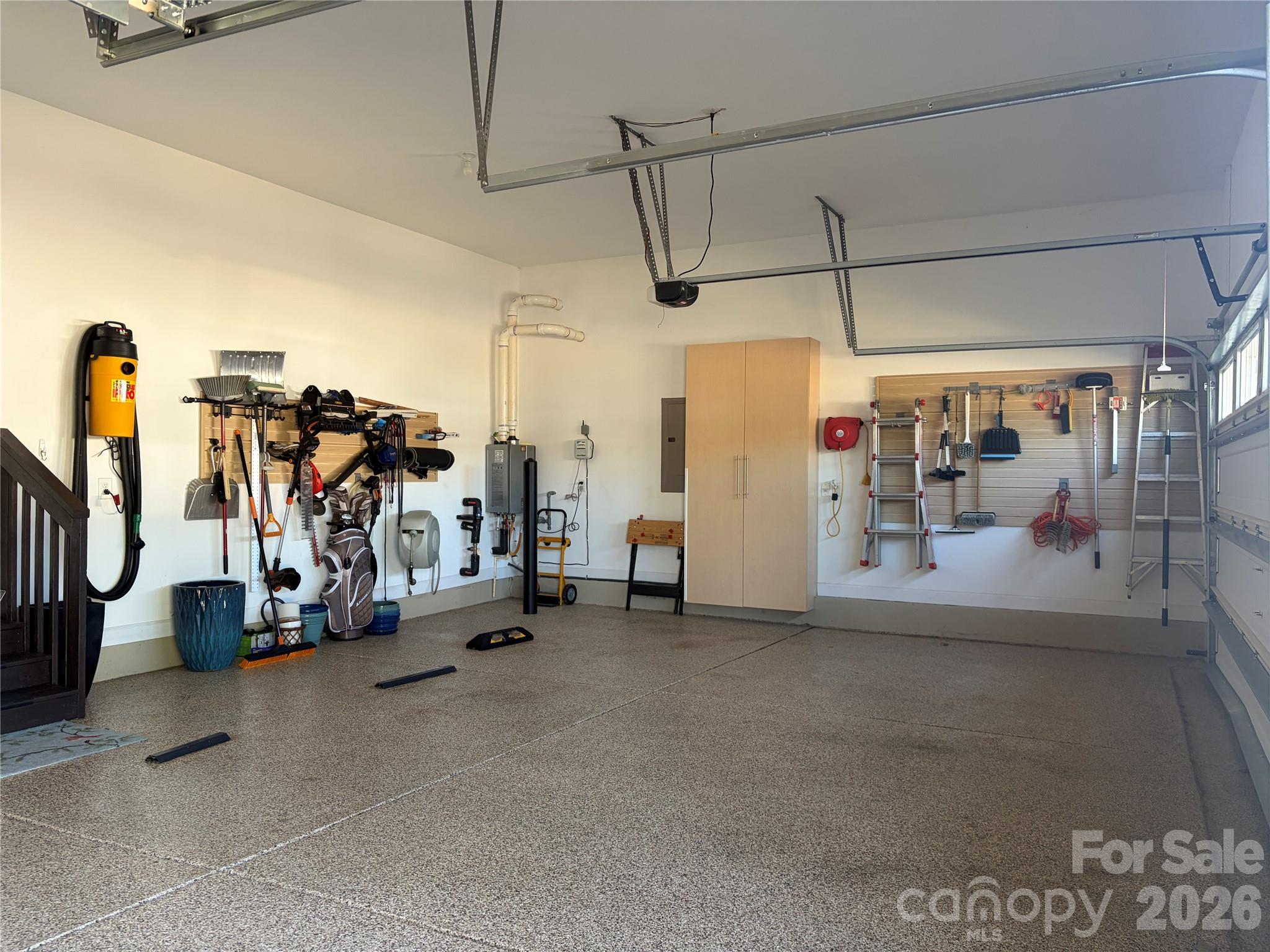 3-car garage with epoxy floors and storage cabinets - 1567 Tranquility Boulevard, Lancaster