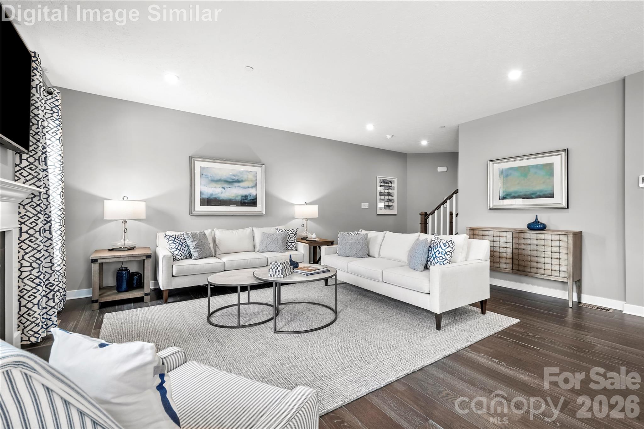 Spacious yet cozy great room with two oversized windows that pour in natural light. Seamlessly connected to the kitchen in an open floorplan—perfect for entertaining guests or curling up with a good book. - 11204 Emerson Landing Drive, Charlotte