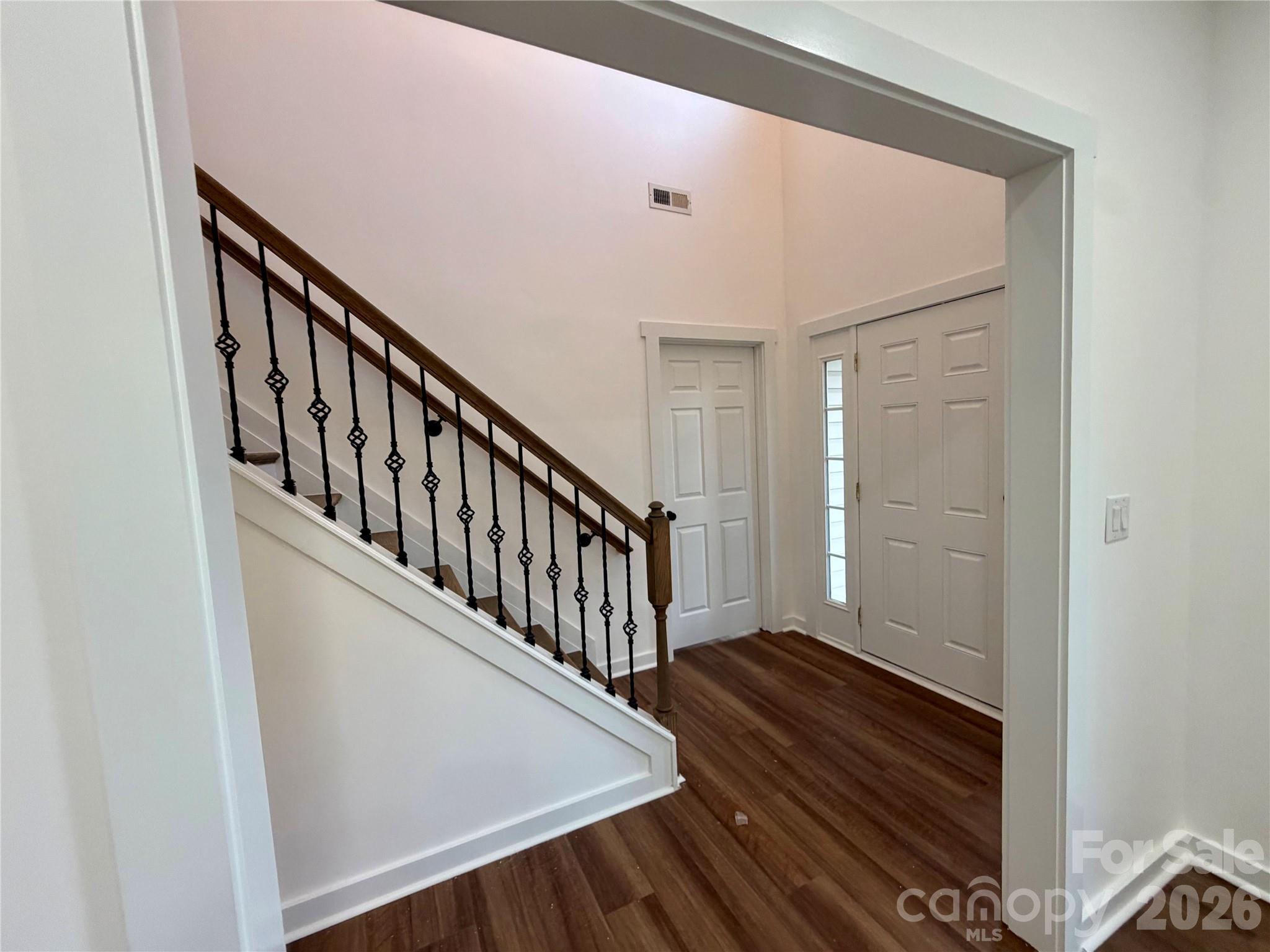 Foyer - New Wrought Iron Balusters, NEW LVP Flooring on main level. - 116 Huckleberry Lane, Mount Holly