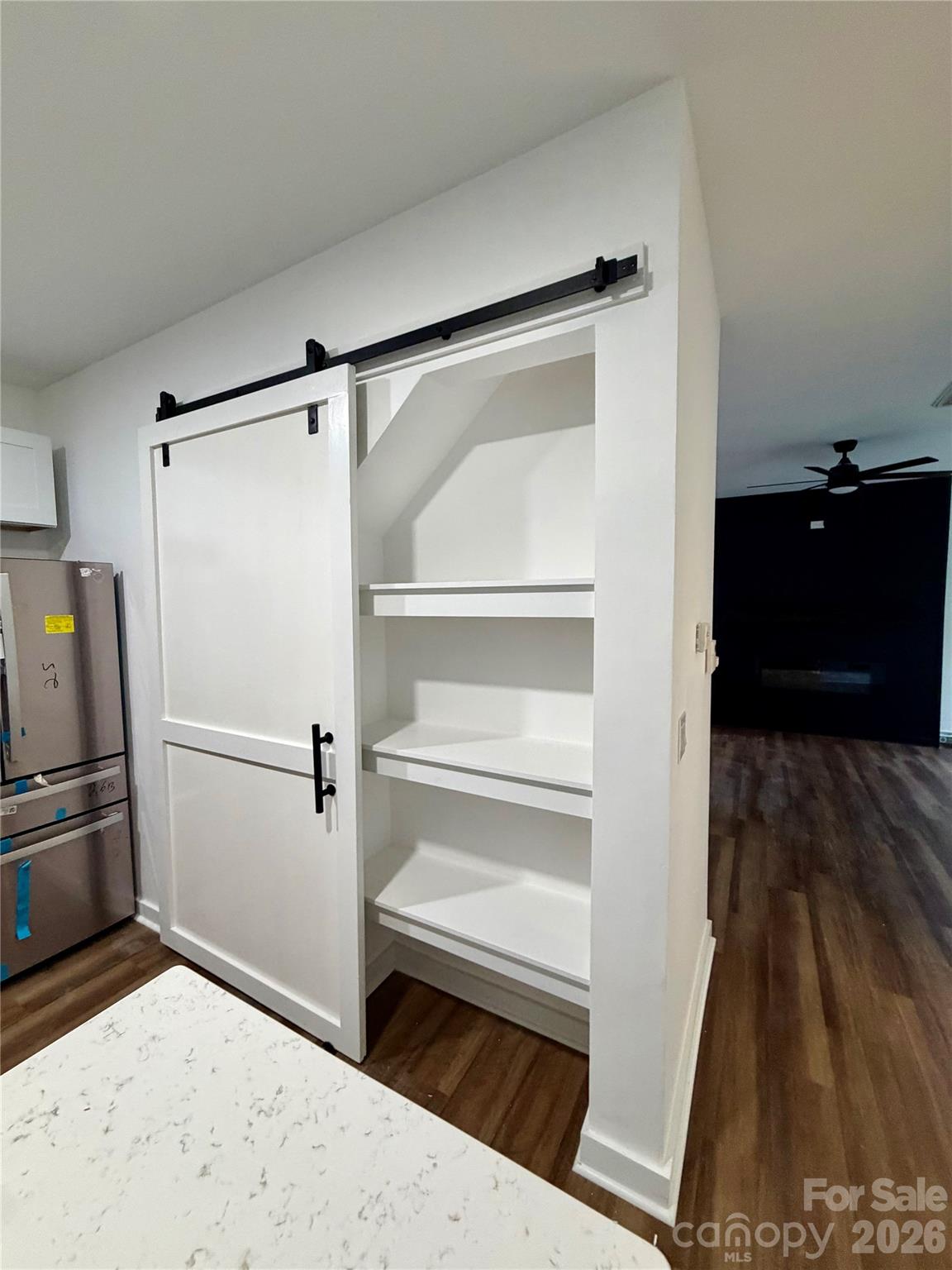 Pantry with a sliding barn door for privacy. NEW LVP Flooring on main level. - 116 Huckleberry Lane, Mount Holly