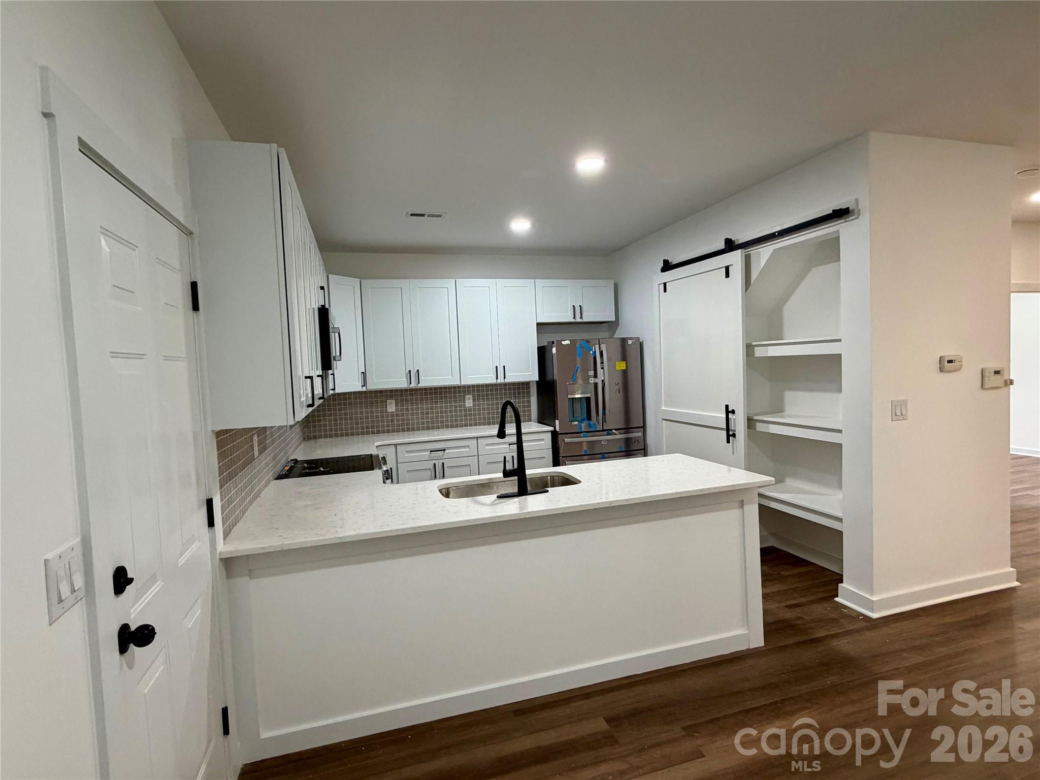 Kitchen with New Quartz Countertops, Complete Updated Kitchen, with 42" cabinets, all New GE Appliances, NEW LVP Flooring on main level. - 116 Huckleberry Lane, Mount Holly