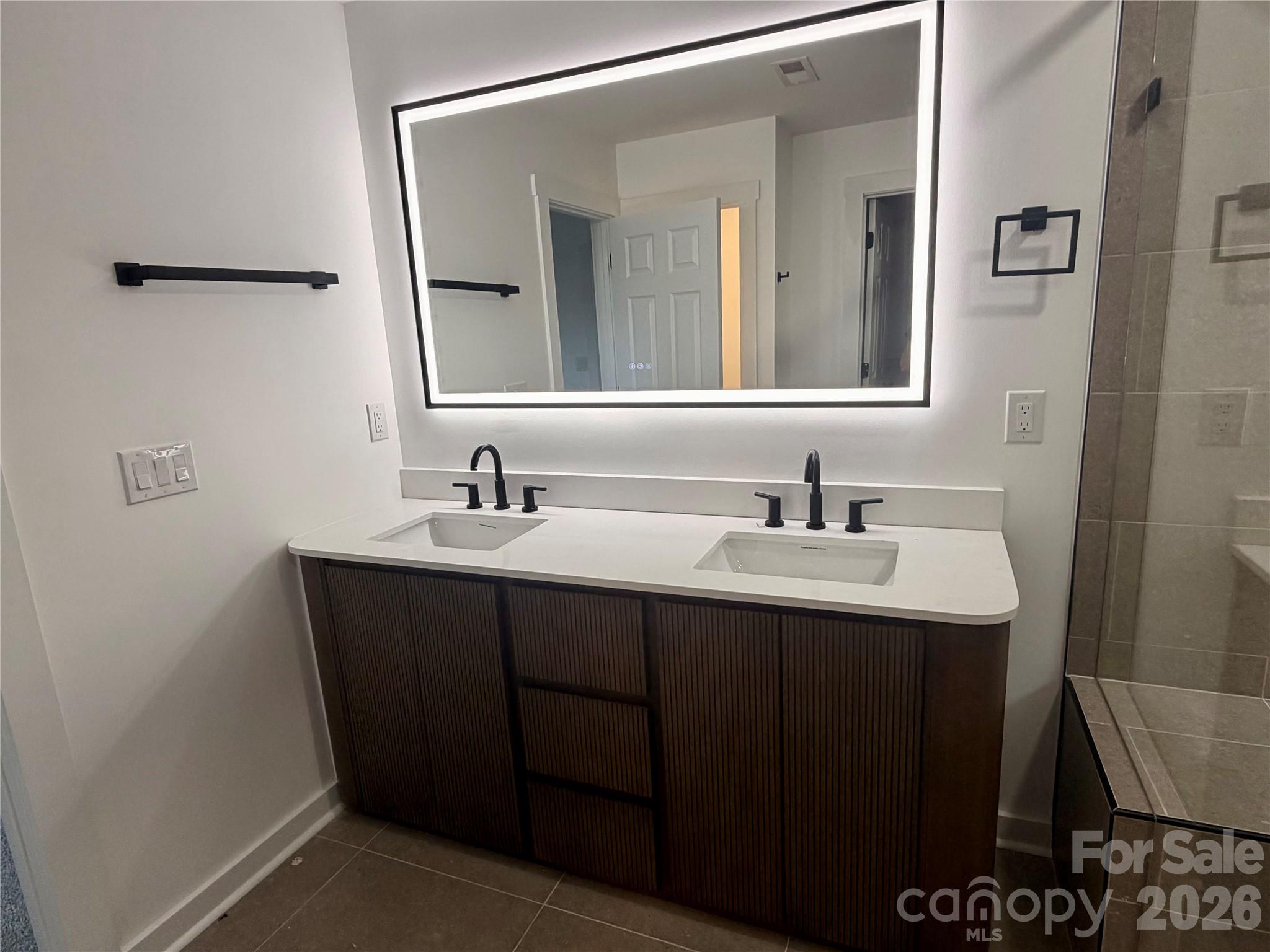 Primary Bathroom - New Tile Surround and new tile floors, New Double Vanity and Heated Lighting Mirror - 116 Huckleberry Lane, Mount Holly