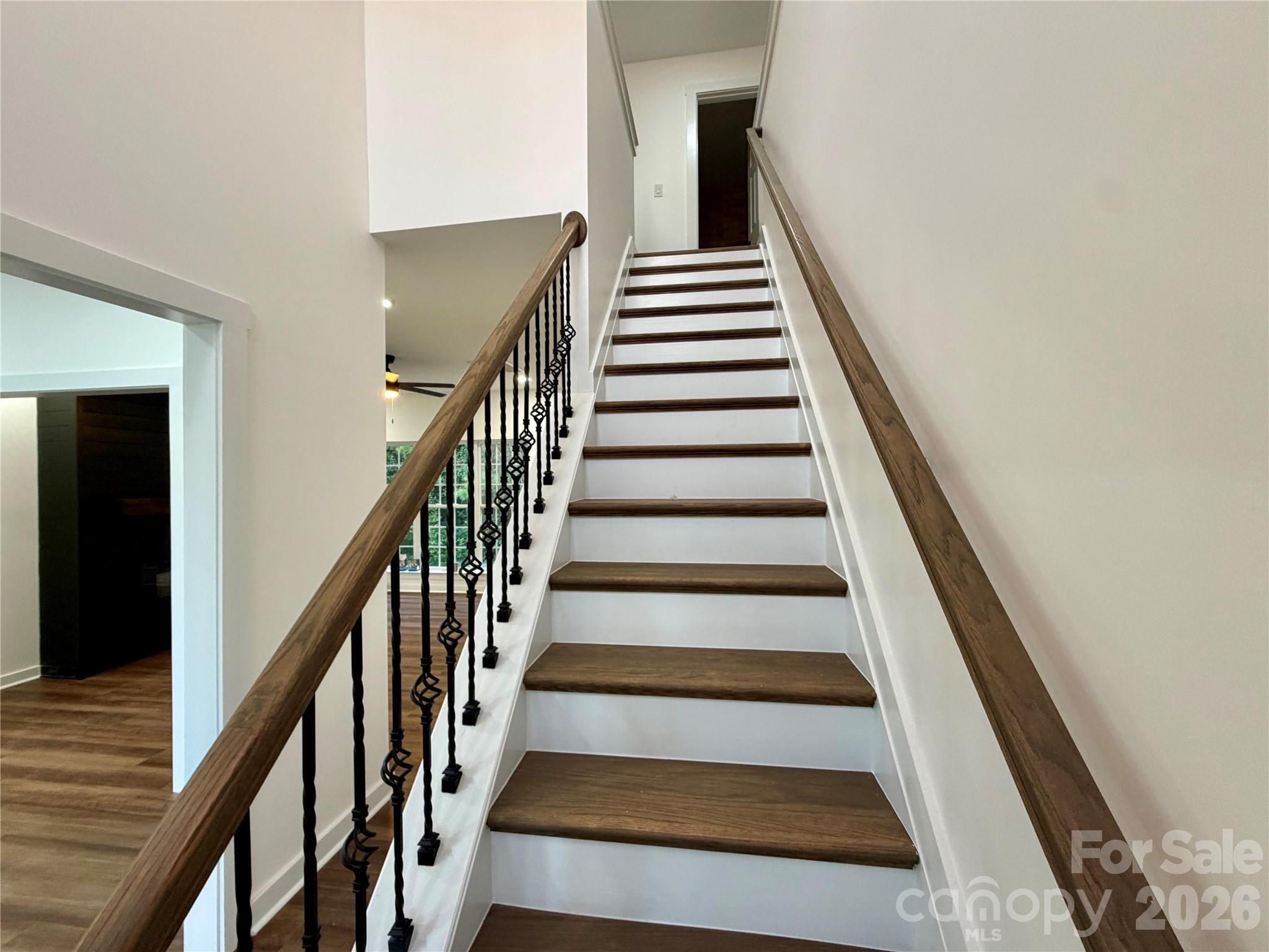 Beautiful Wrought Iron Ballester's on these updated wood stairs - 116 Huckleberry Lane, Mount Holly