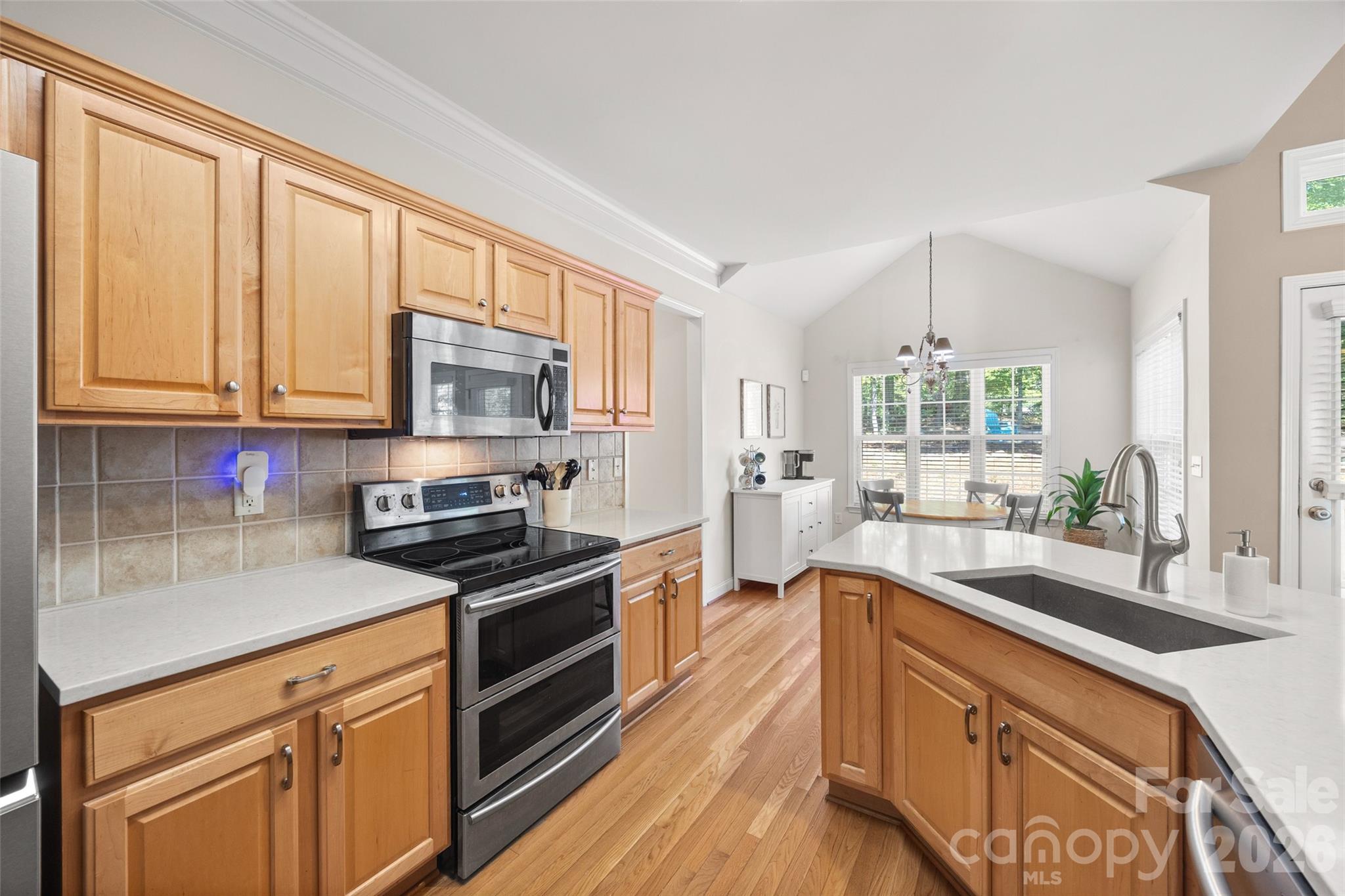 Kitchen with stainless appliances - 1718 Sanridge Wind Lane, Charlotte