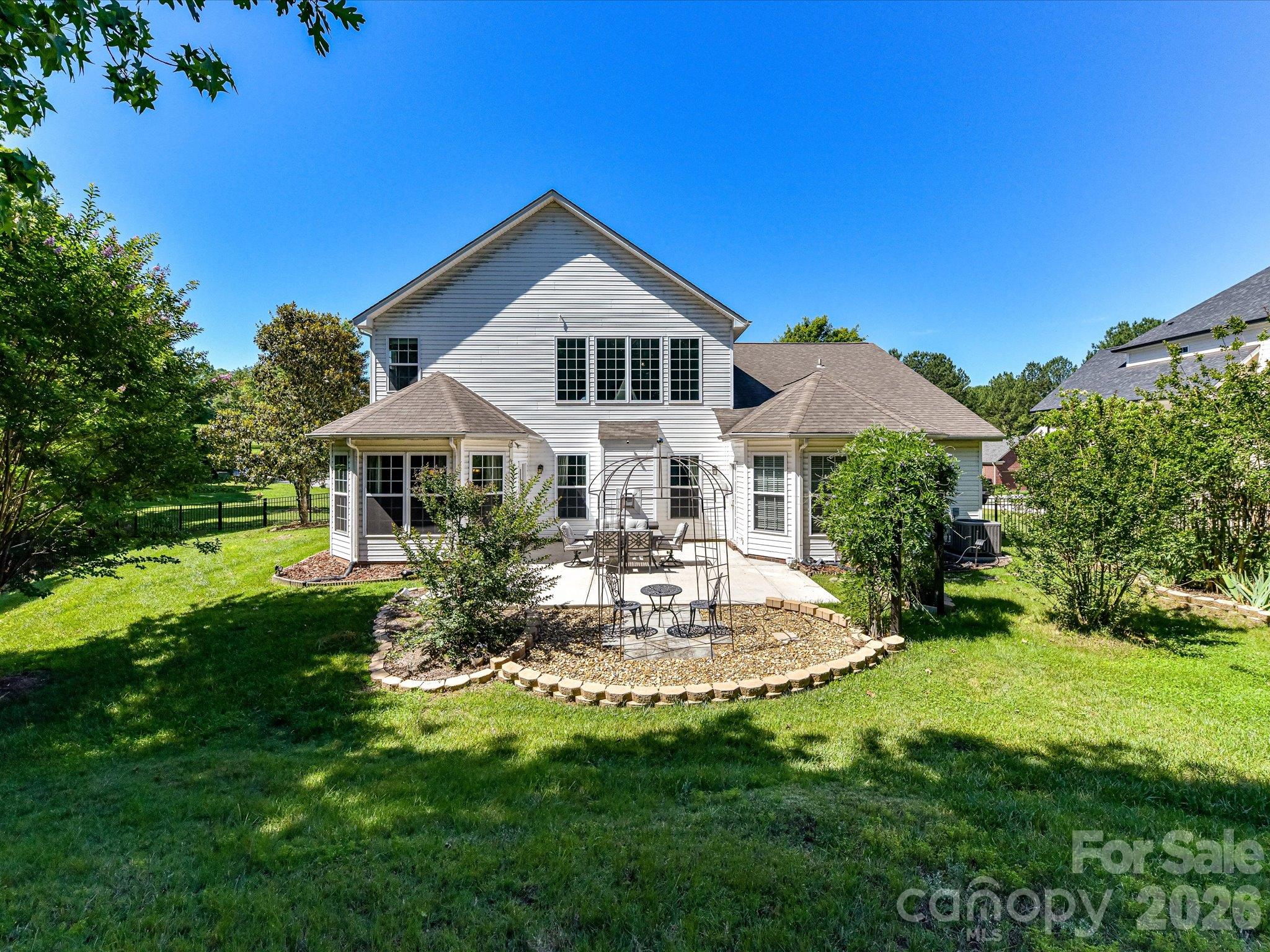 The peaceful backyard offers plenty of space for outdoor dining and living. - 1788 Oakmont Drive, Denver