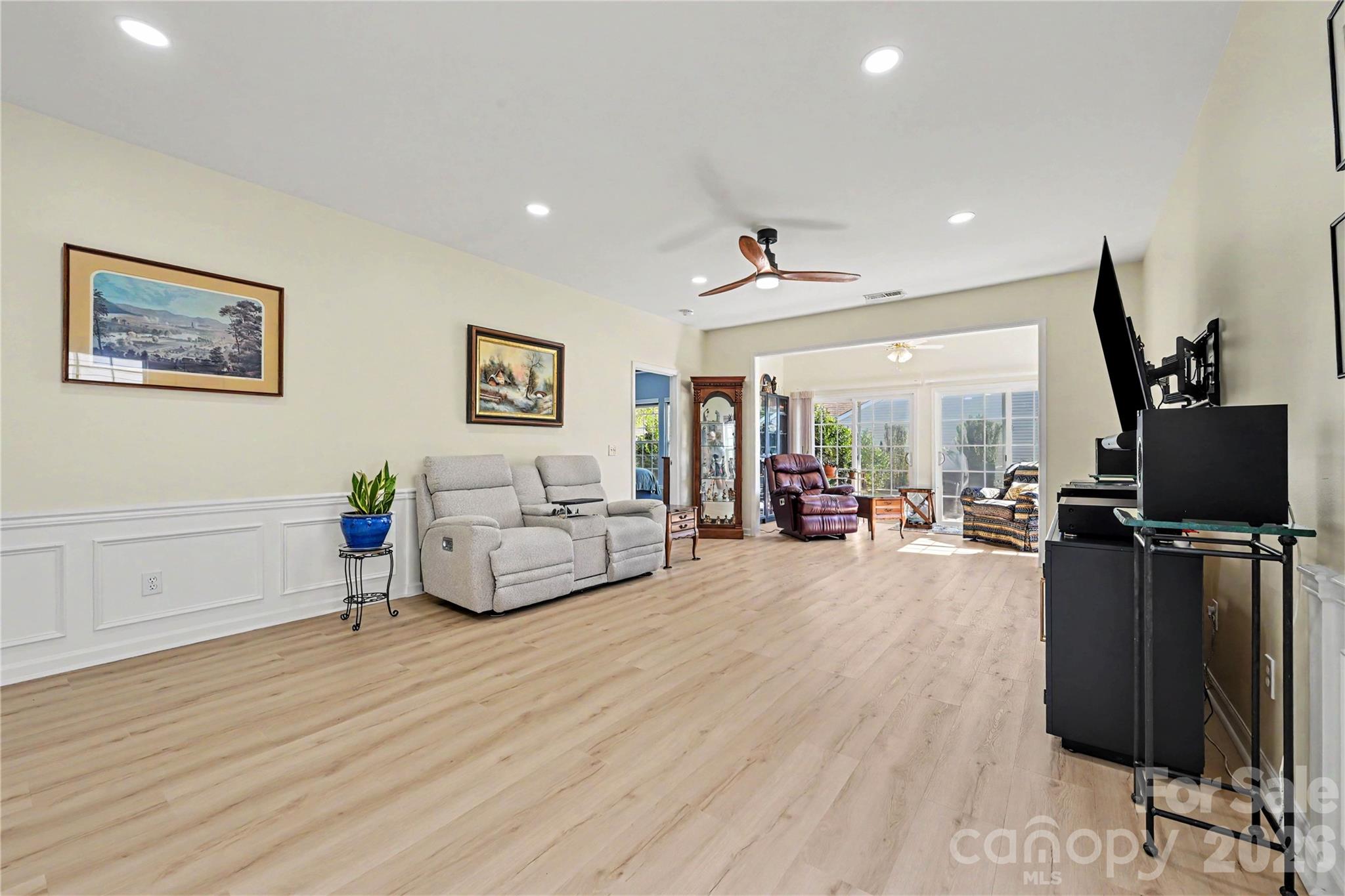 HUGE GREAT ROOM features NEW LVP flooring, neutral paint, ceiling fan, and MANY LED Flush ceiling lights. - 3054 Azalea Drive, Indian Land