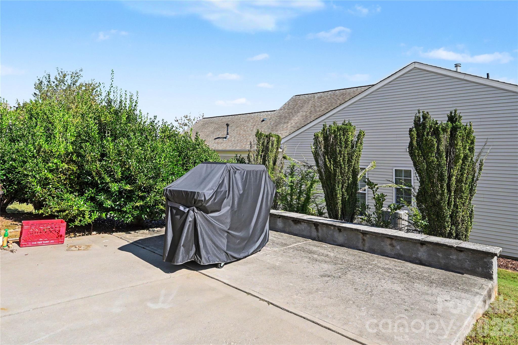 Patio features DUAL Sliding Glass doors access, knee wall, and mature landscaping. - 3054 Azalea Drive, Indian Land
