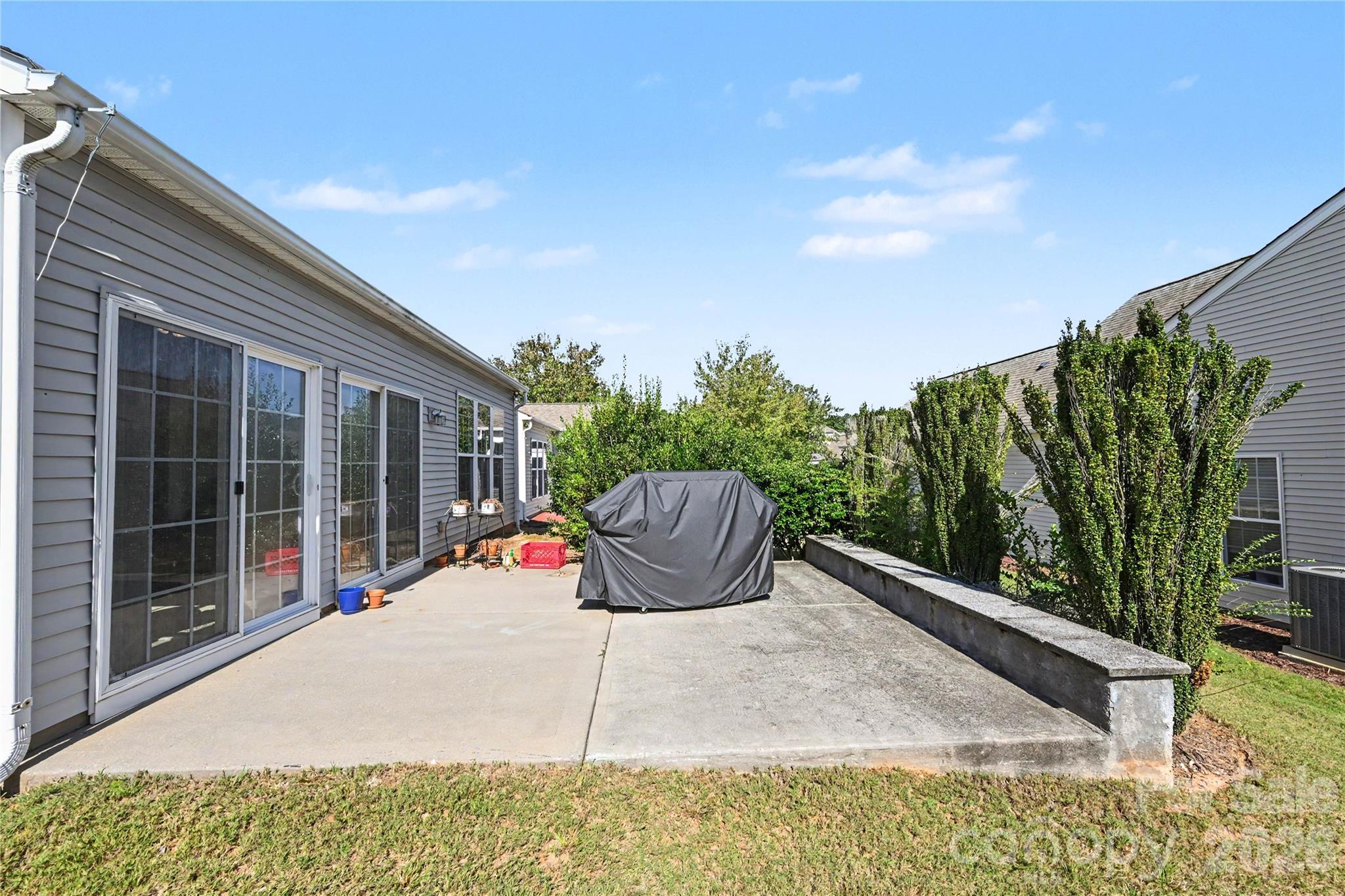 View of Patio as seen from side of home. Perfect for morning coffee or grilling. - 3054 Azalea Drive, Indian Land