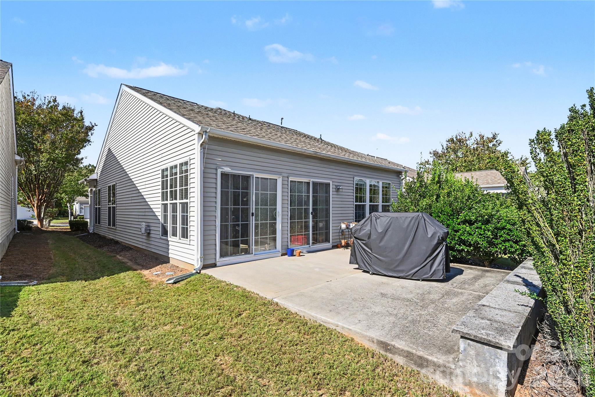 Another view of the patio and backyard area of home. - 3054 Azalea Drive, Indian Land