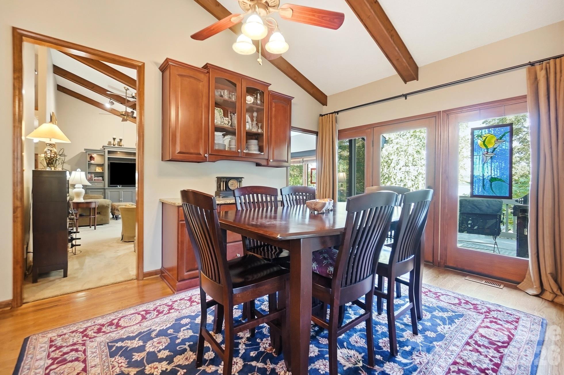 Dining room with built-in cabinetry and glorious lake views - 1669 Aragon Beach Road, Rock Hill