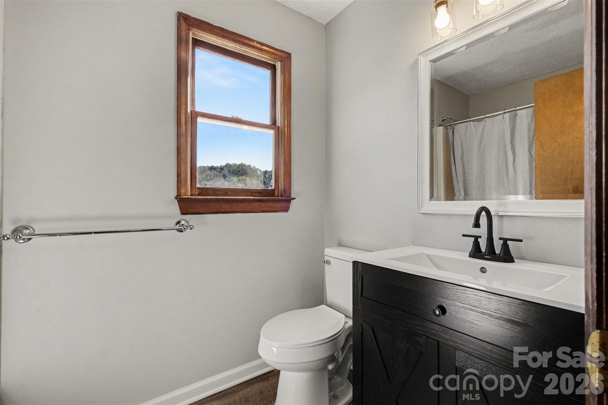 Owners' bathroom has a beautiful new vanity and other updates. - 102 Roxie Lane, Belmont