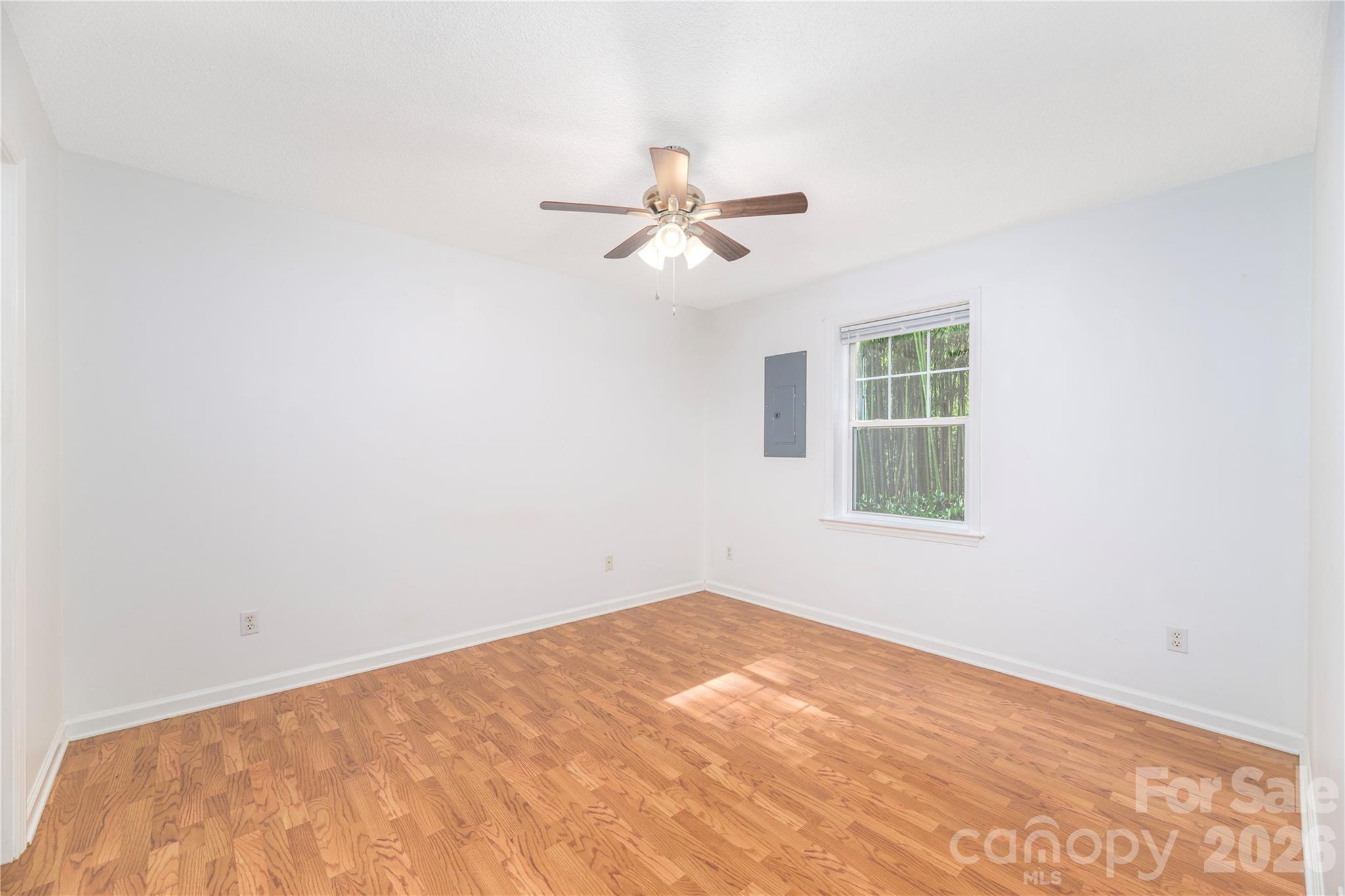 Light-filled bedroom in basement apartment. - 17 Sheridan Road, Asheville