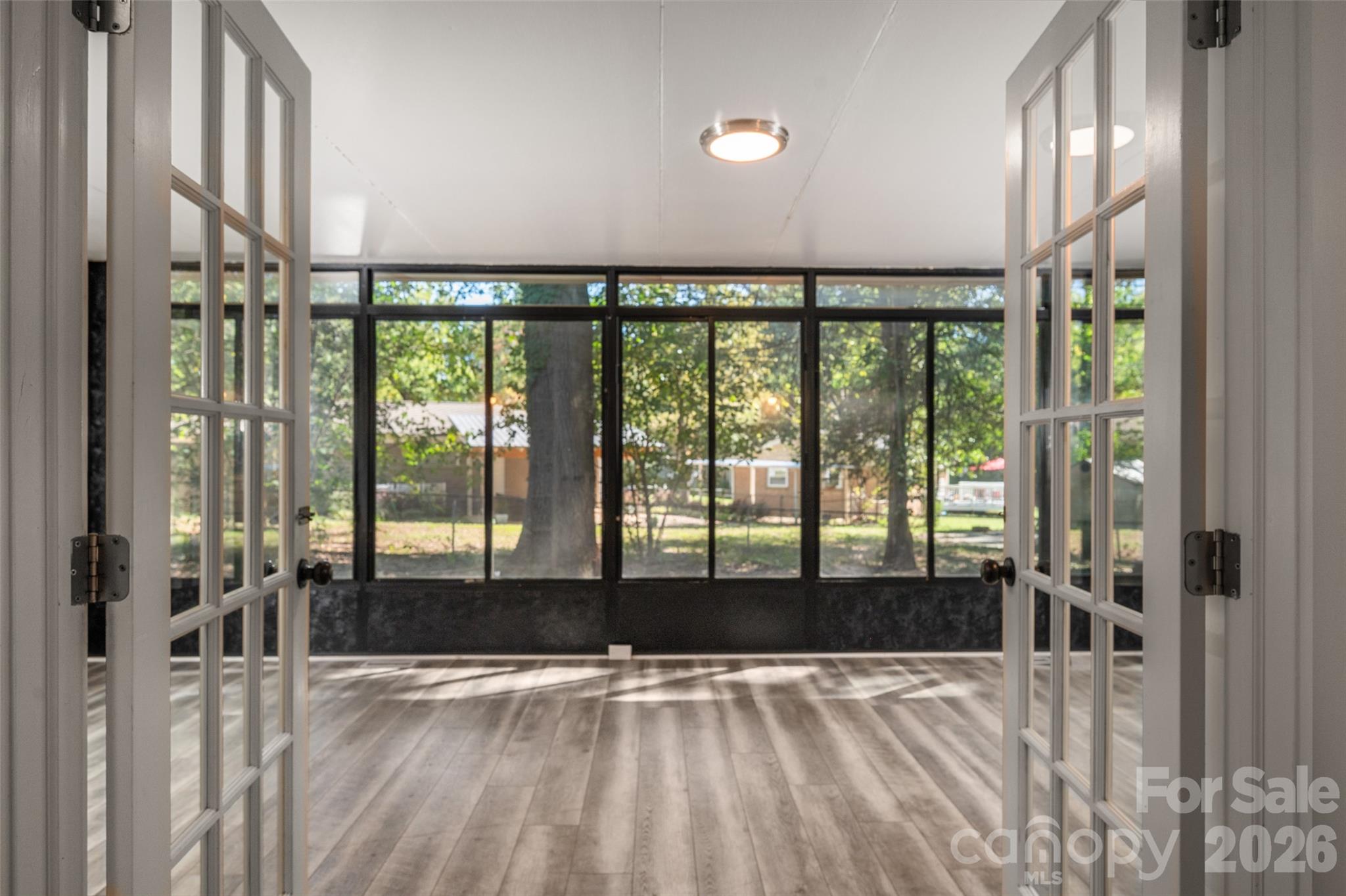 French doors lead to beautiful sunroom - 4238 Dowling Drive, Charlotte