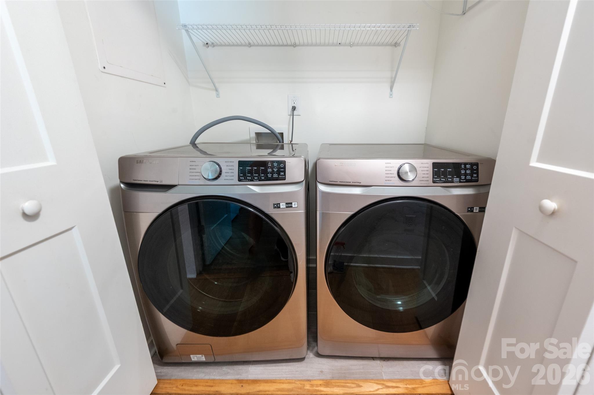 Laundry closet is in the main hall, opposite the Primary Suite - 4238 Dowling Drive, Charlotte