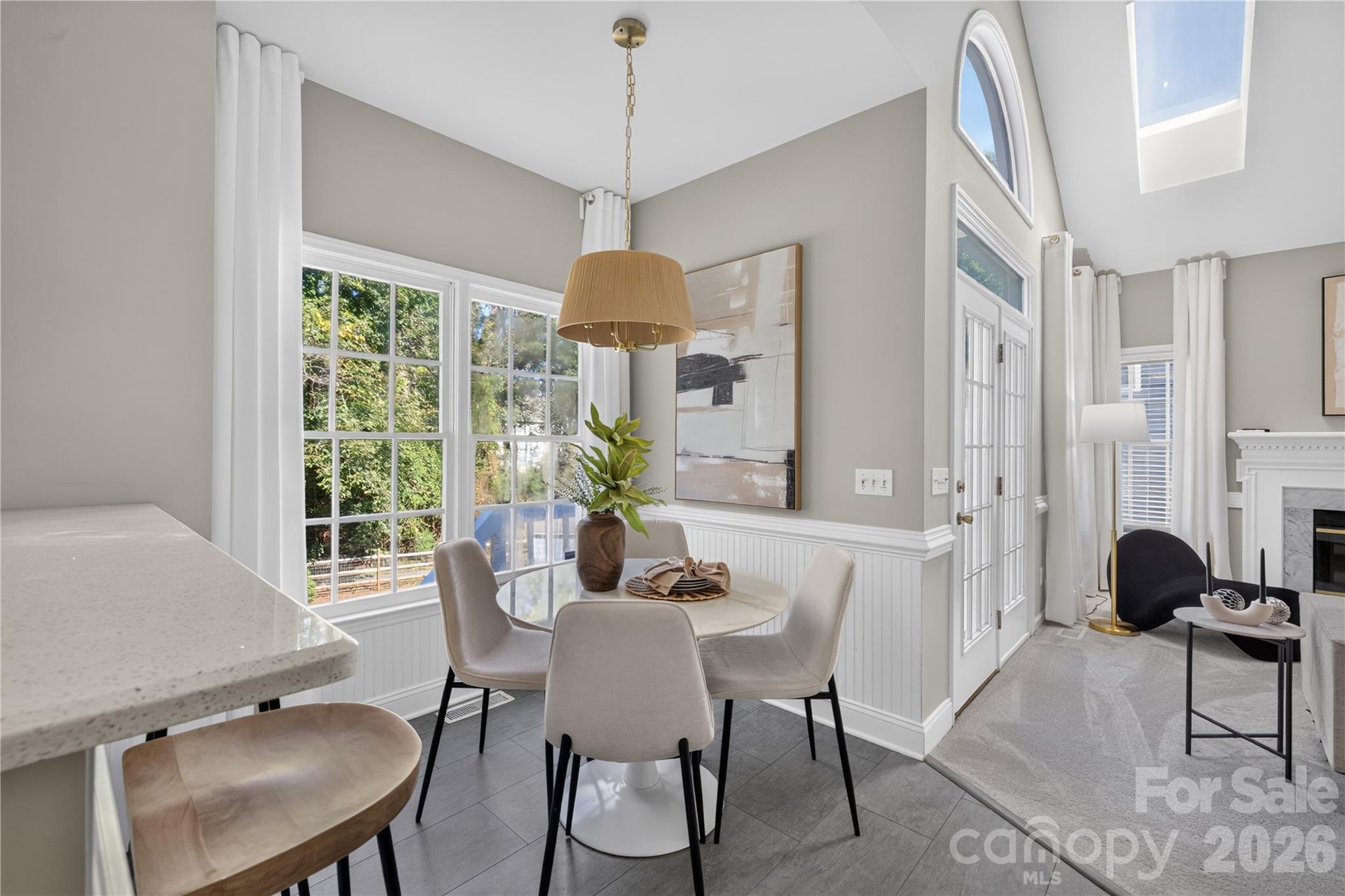 Breakfast area with views of the backyard. - 4711 Beech Crest Place, Charlotte