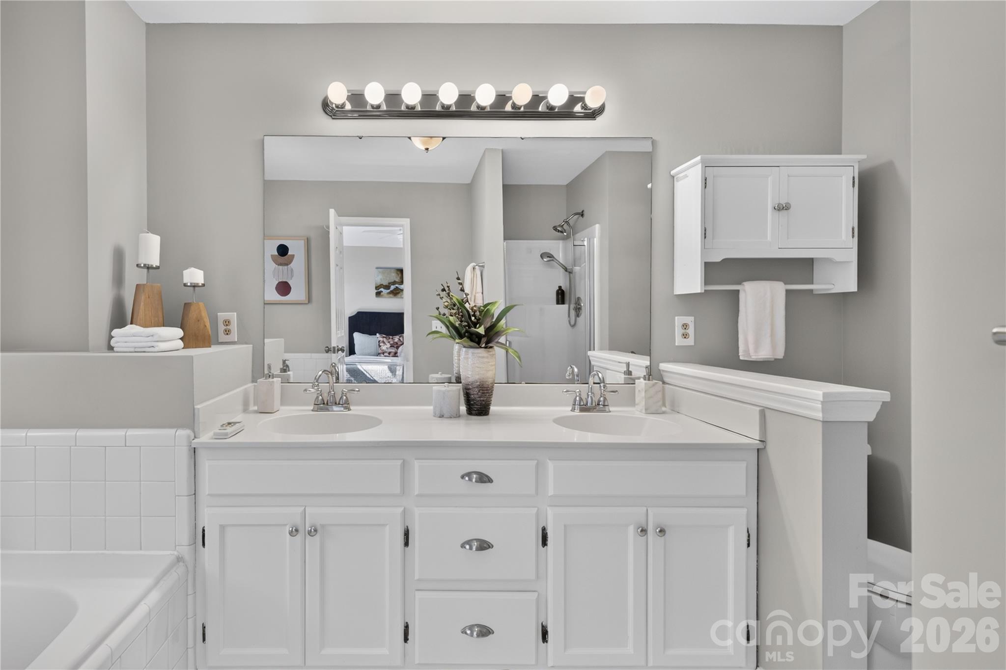 Spacious en suite bath with garden tub, dual vanity, new flooring and separate shower. - 4711 Beech Crest Place, Charlotte