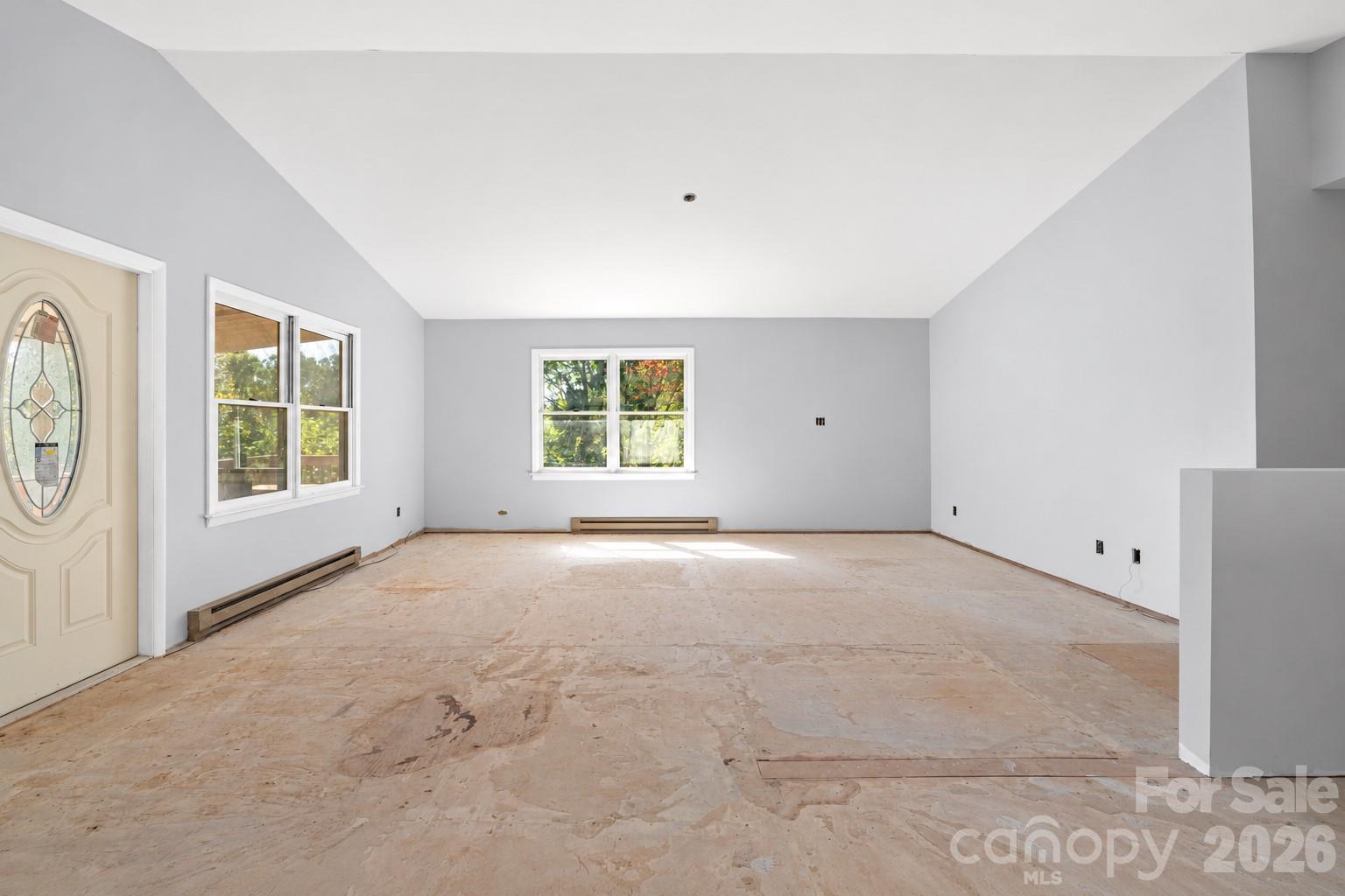 Spacious main living area with abundant natural light and a flexible open layout. - 117 & 99999 Spivey Mountain Road, Asheville