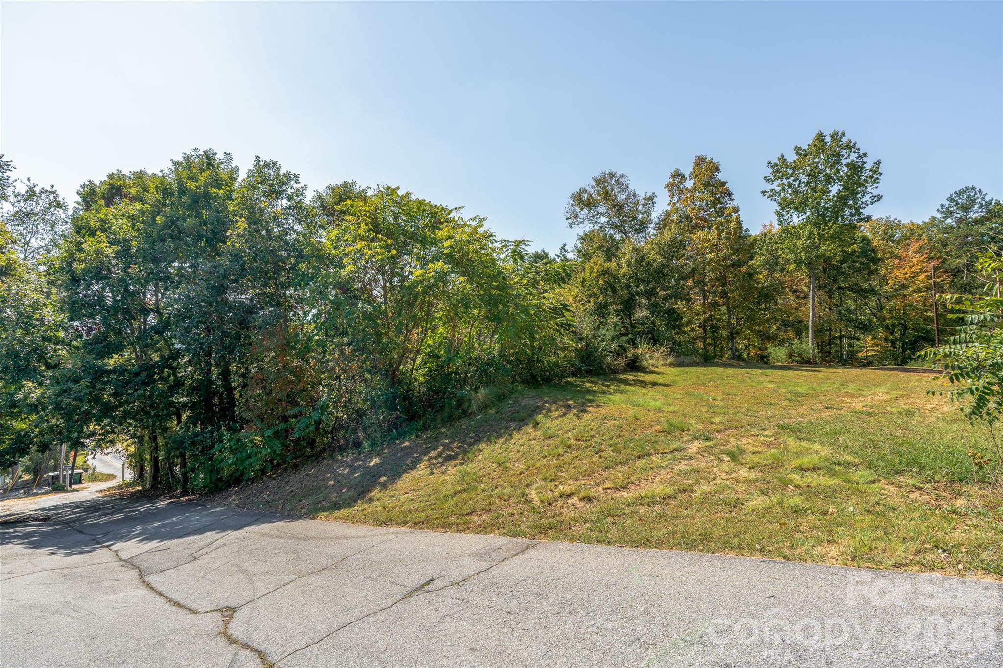 The homesite is already cut in—bring your plans and make the most of the mountain setting and views. - 99999 Spivey Mountain Road, Asheville