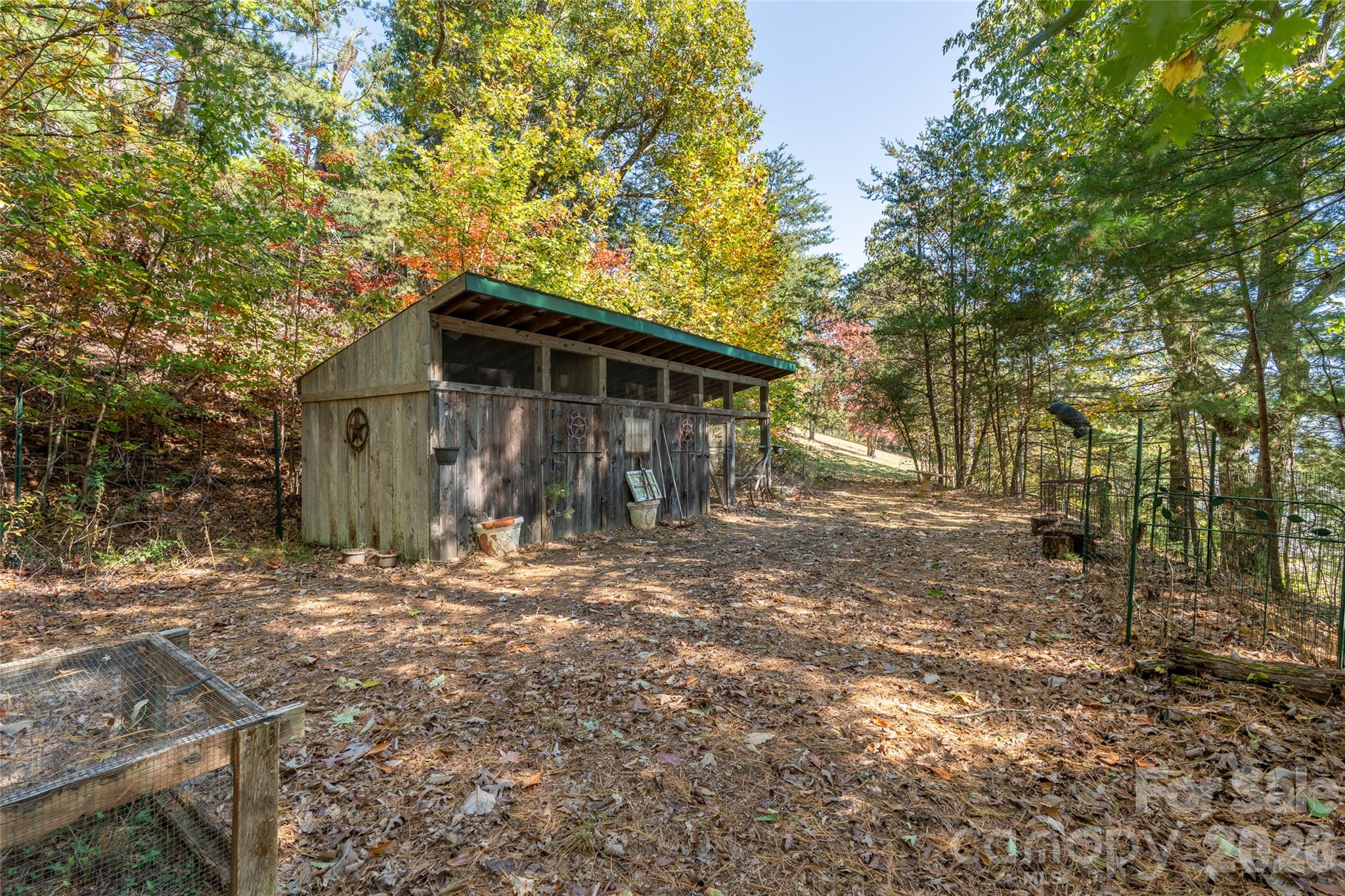 Existing outbuilding sits on another potential homesite, adding flexibility and future possibilities. - 99999 Spivey Mountain Road, Asheville