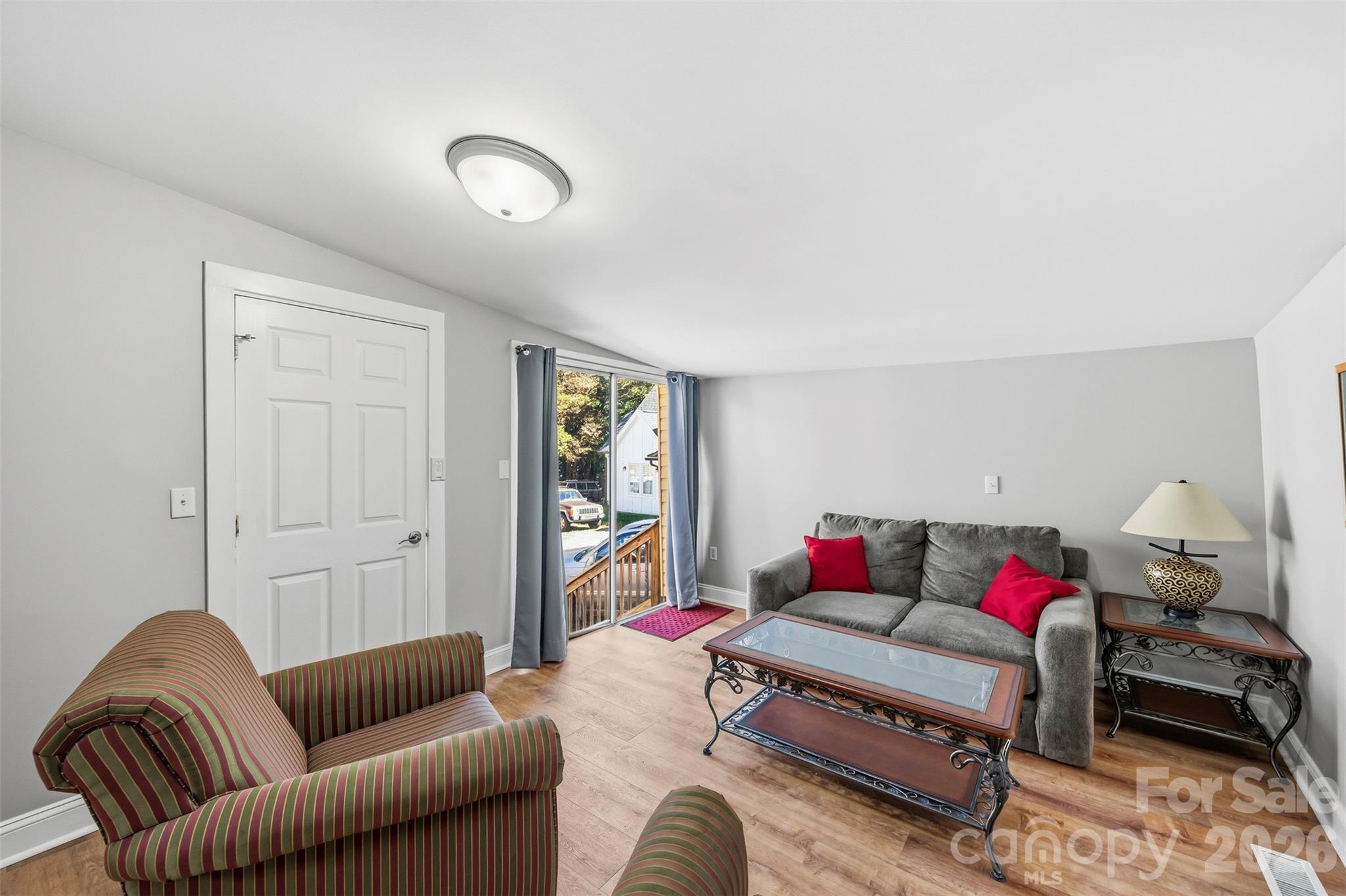 Family room with a door out to the deck. - 220 Armour Street, Davidson