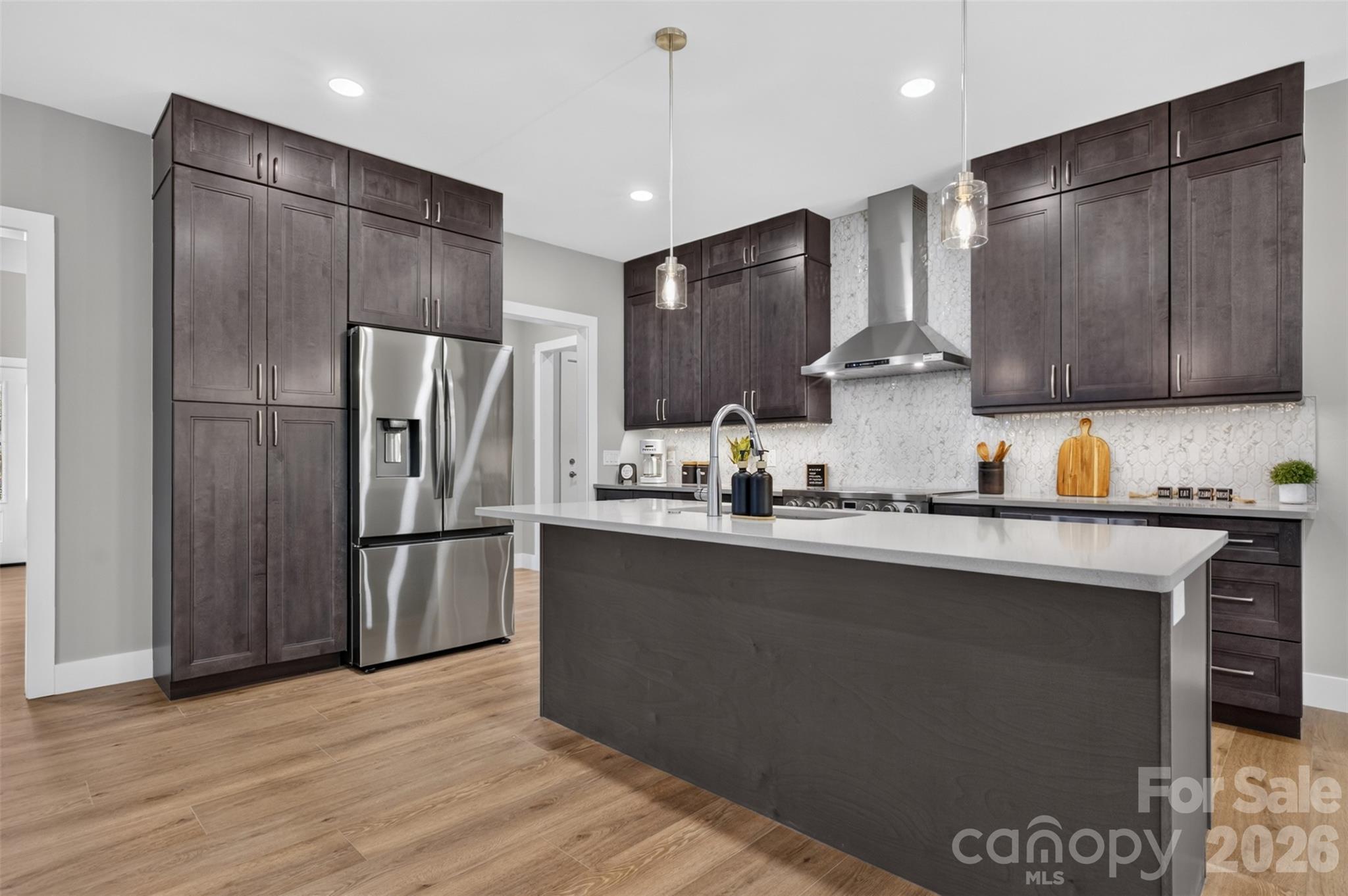 The kitchen is open to the living room and conveniently located steps away from the garage and laundry room. - 160 Pumice Drive, Statesville