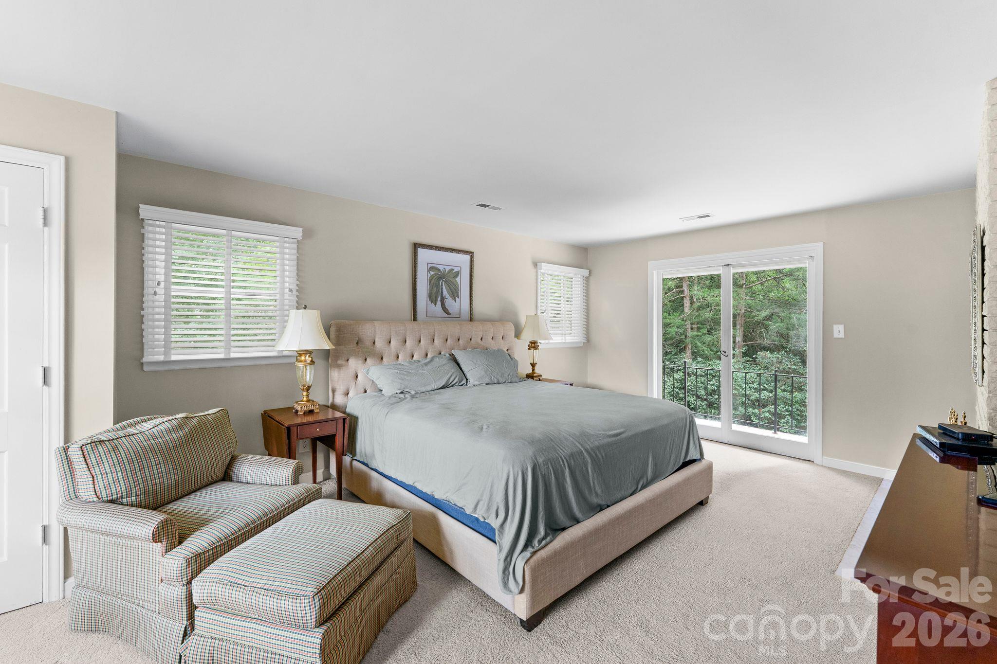 Sliding glass doors to a balcony off the Primary Bedroom - 2006 Grey Road, Davidson