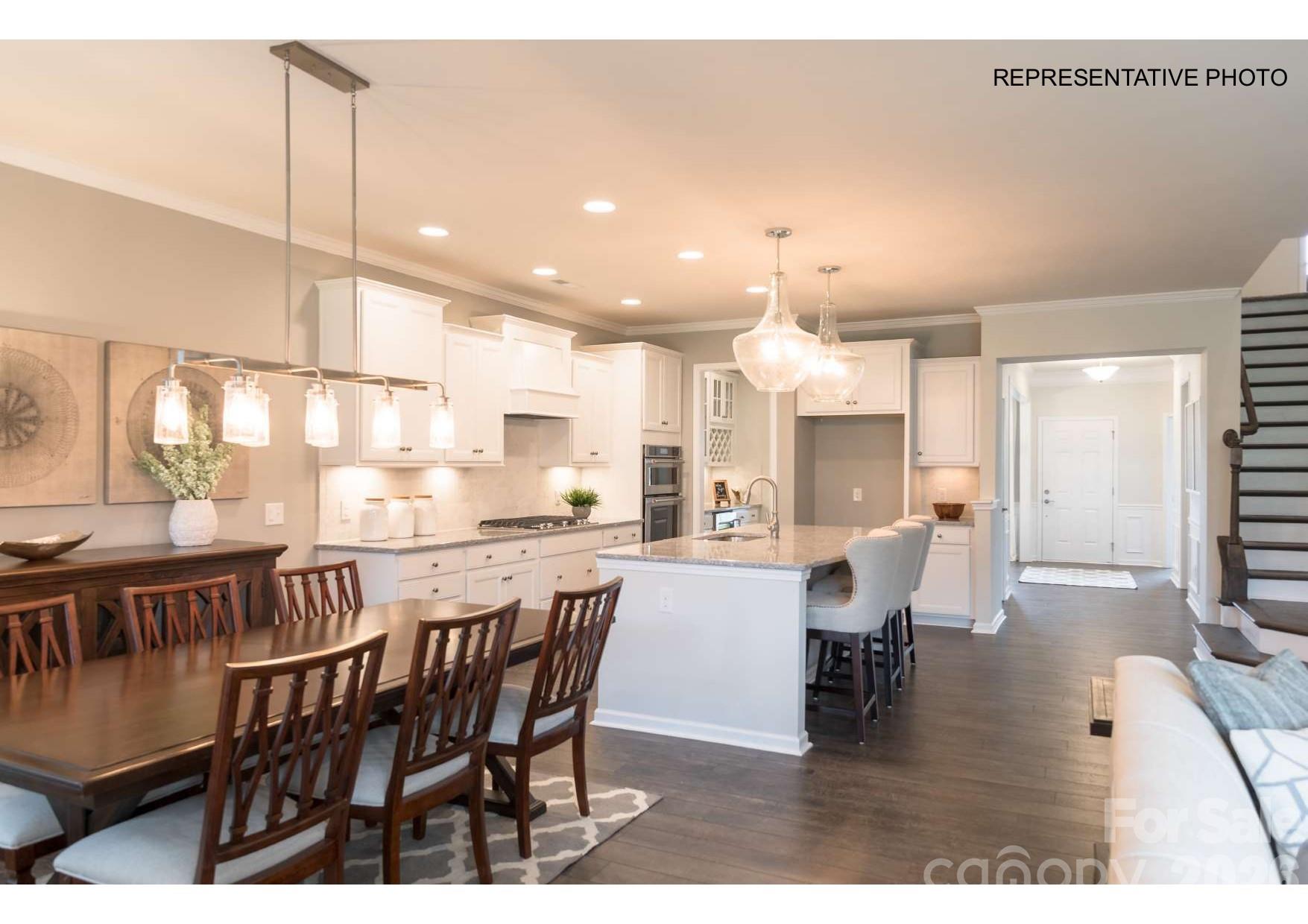 Kitchen flows seamlessly into the cafe... - 7689 Pedigree Circle, Lancaster