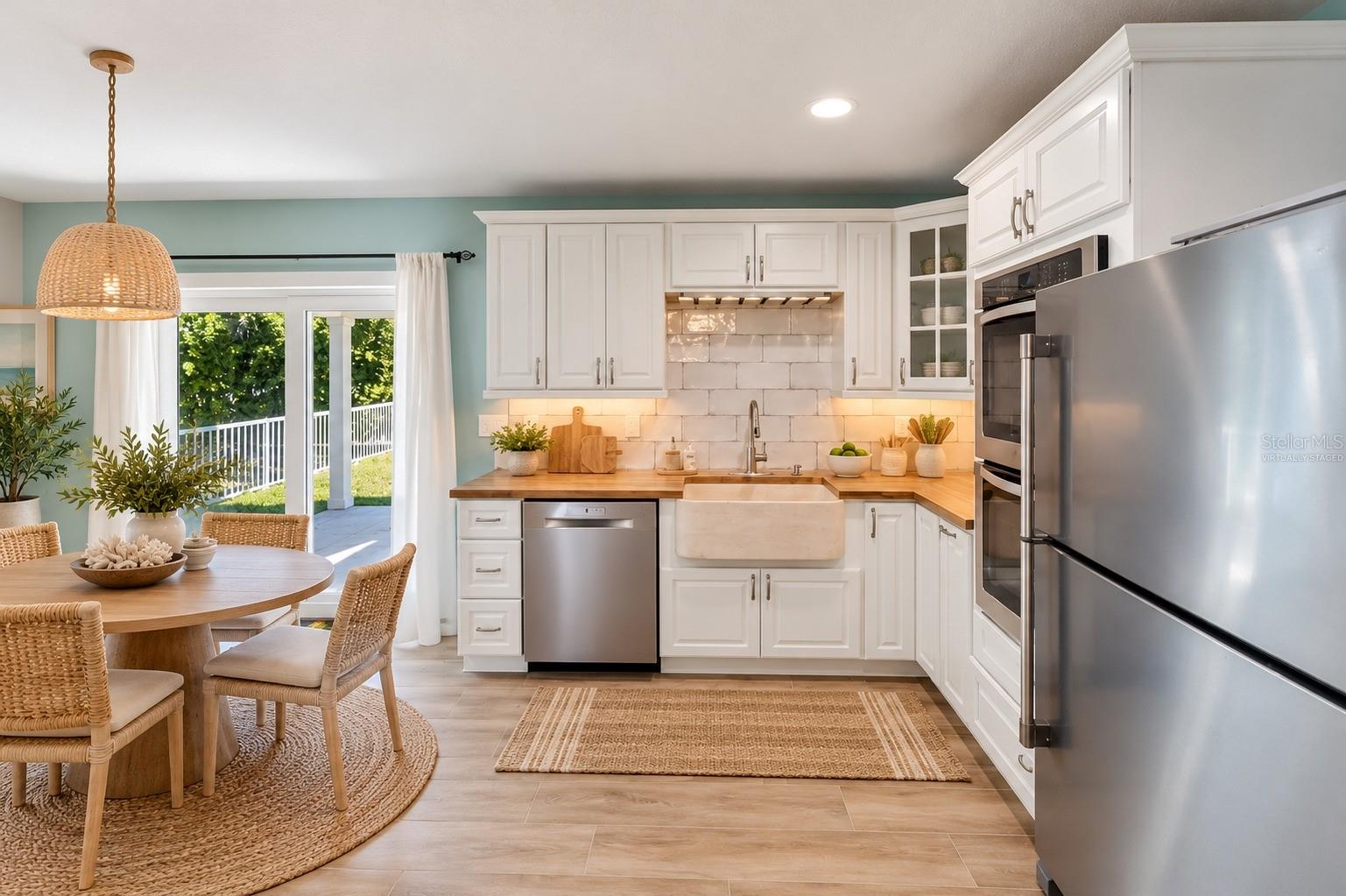 First Floor kitchen (Virtually Staged) - 6191 TURTLEMOUND RD, NEW SMYRNA BEACH