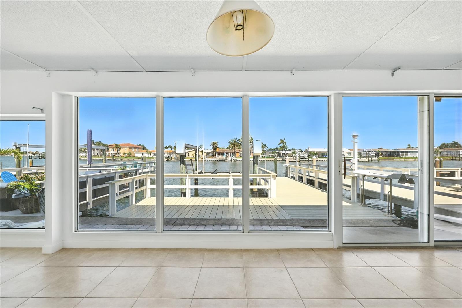 The enclosed Florida room has a double polyurethane and aluminum roof which provides extra strength and sound protection. - 545 BOCA CIEGA POINT BLVD N, ST PETERSBURG