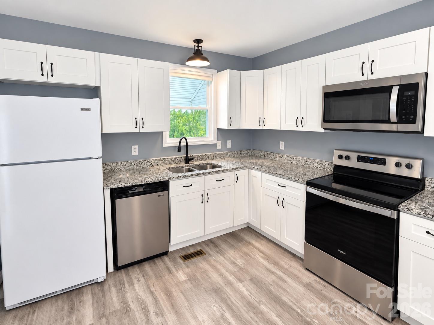 Kitchen - picture has been virtually edited for lighting and staging purposes - 745 6th Avenue SW, Hickory