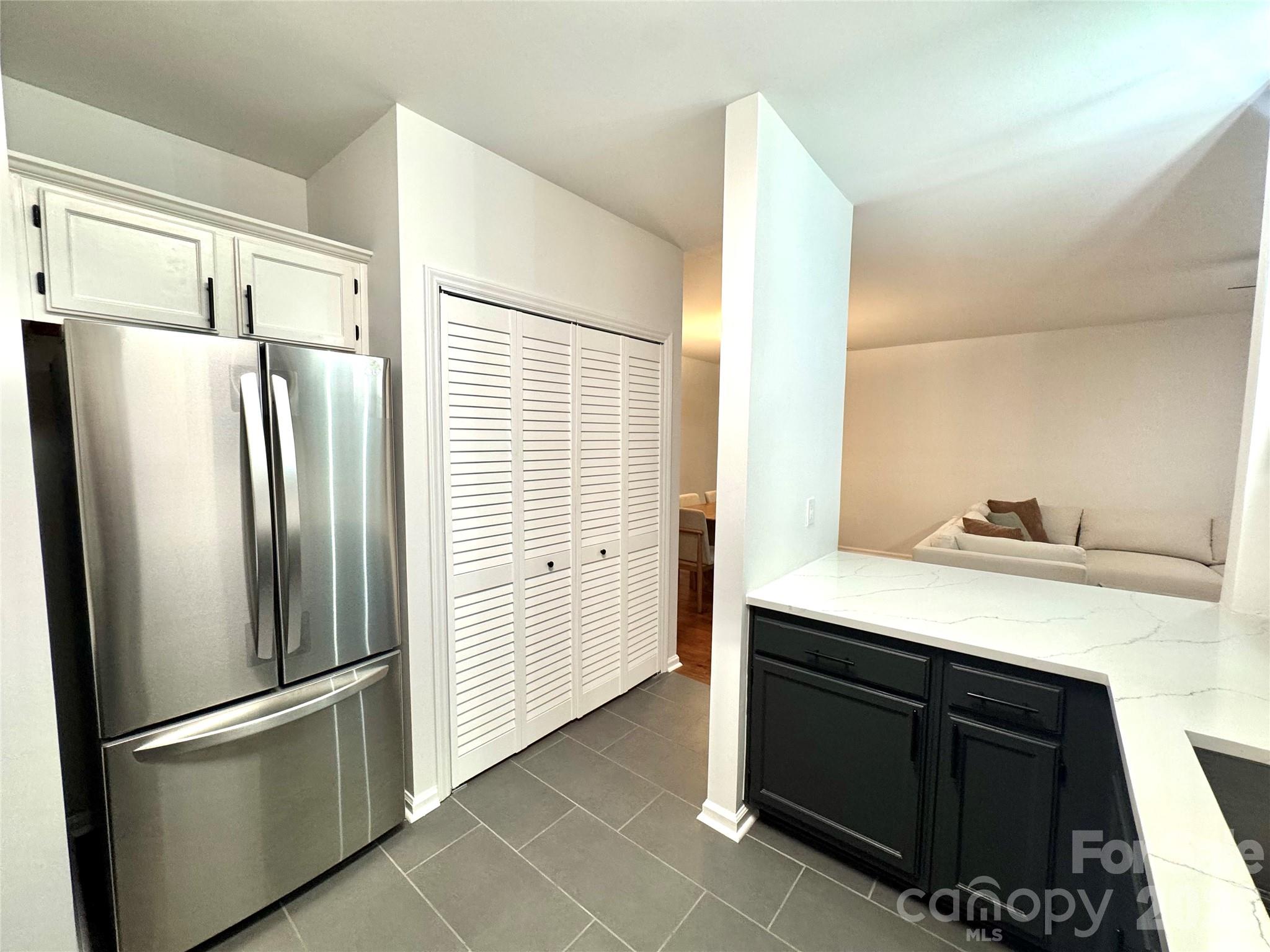 New refrigerator, beautiful tile floors and louvered laundry area - 3302 Selwyn Farms Lane, Charlotte