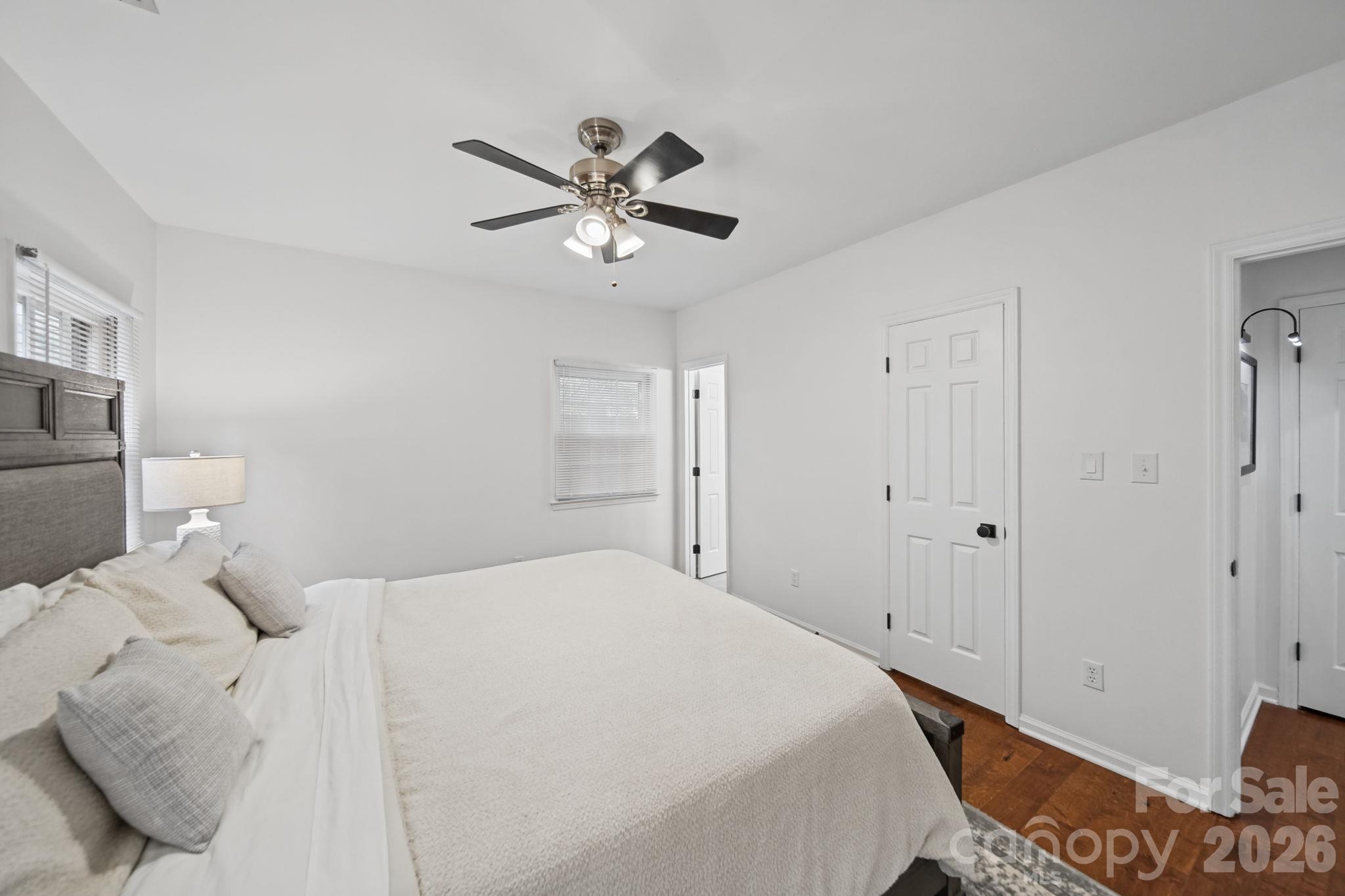 Primary Bedroom with lots of windows displaying entrance off foyer, closet and bath - 3302 Selwyn Farms Lane, Charlotte