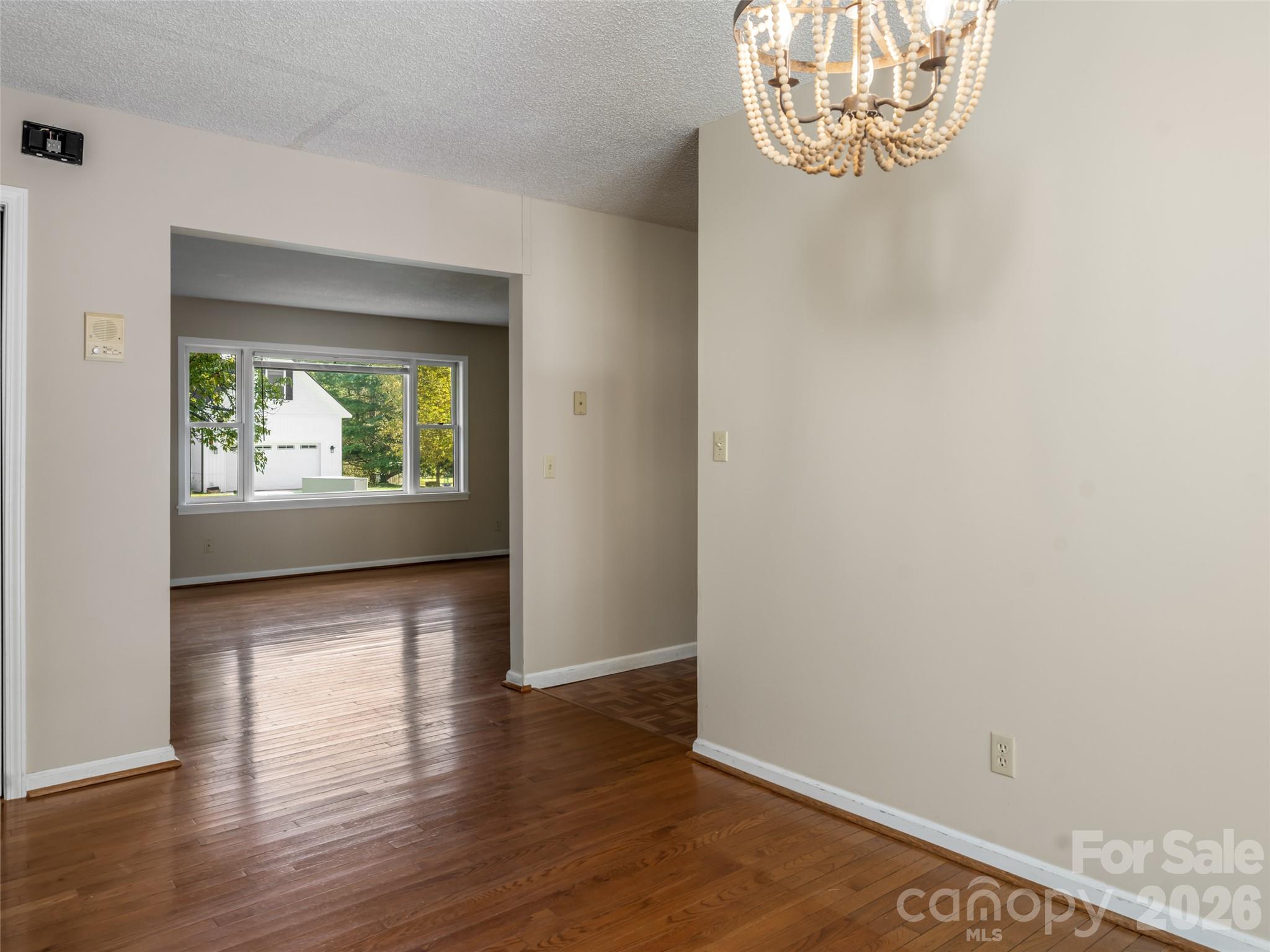 Living room flows seamlessly into the dining room - 47 Cane Creek Circle, Fairview