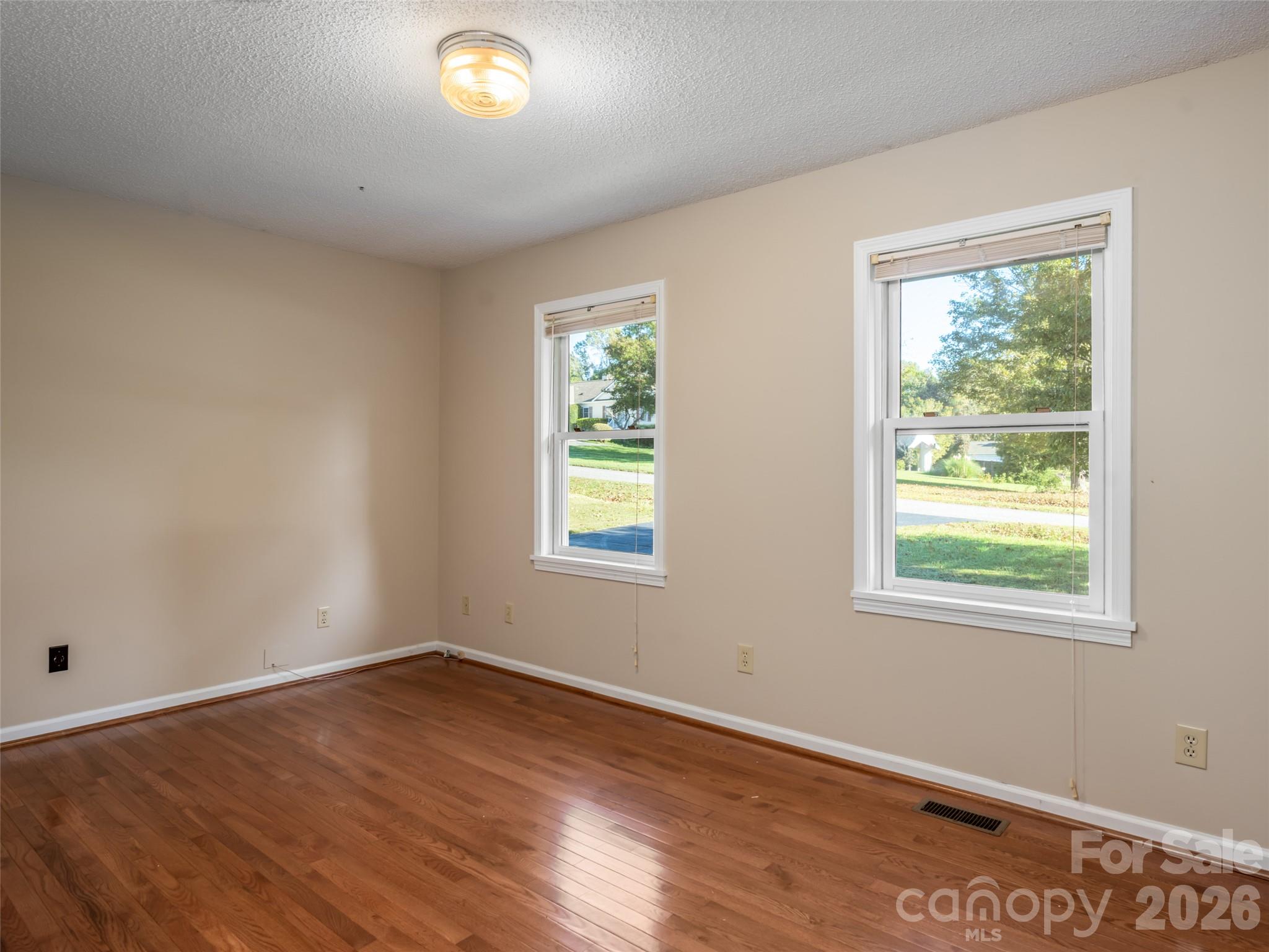 Hardwood floors in main level bonus room - 47 Cane Creek Circle, Fairview