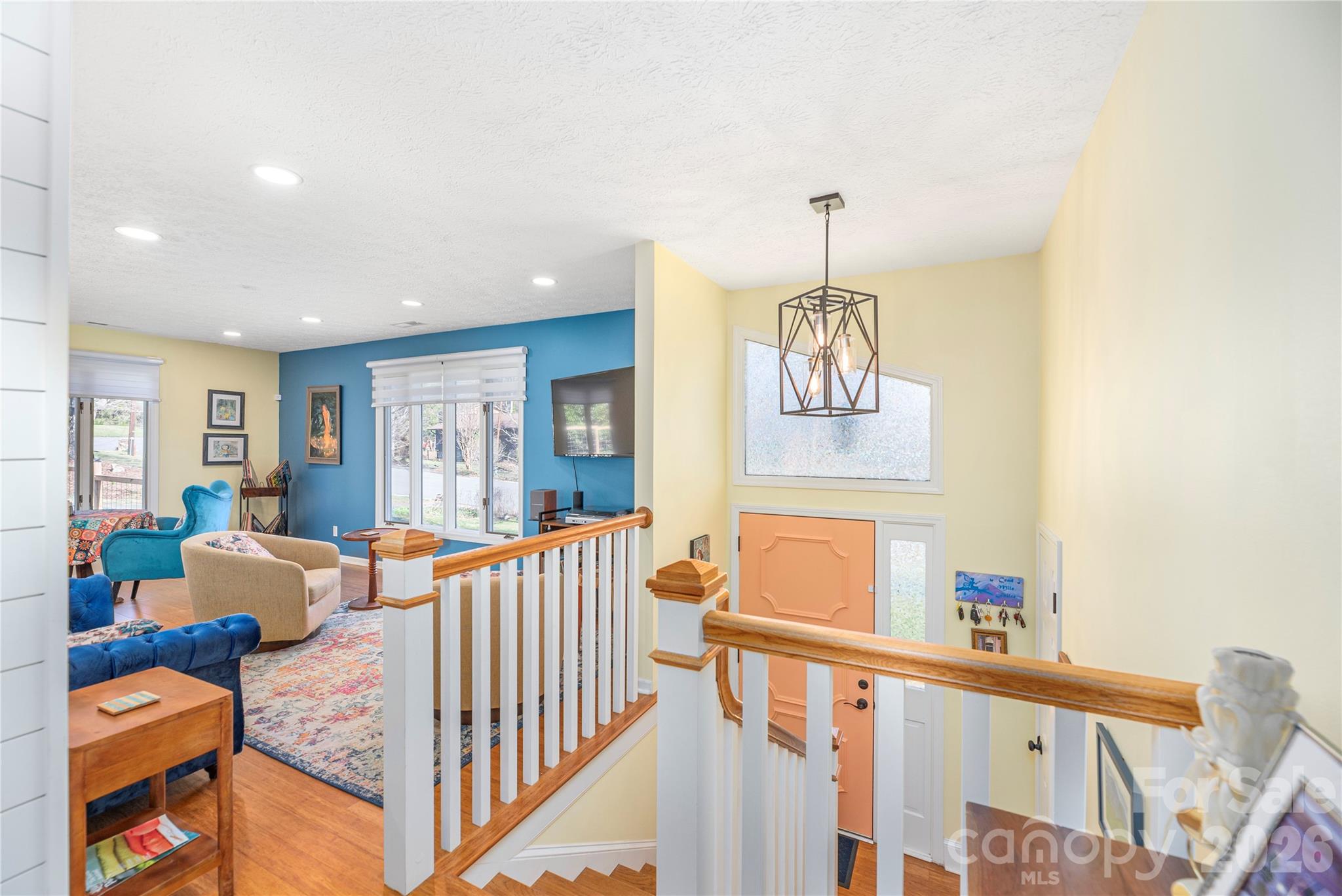 View of light filled entryway and living room - 330 Woody Lane, Asheville