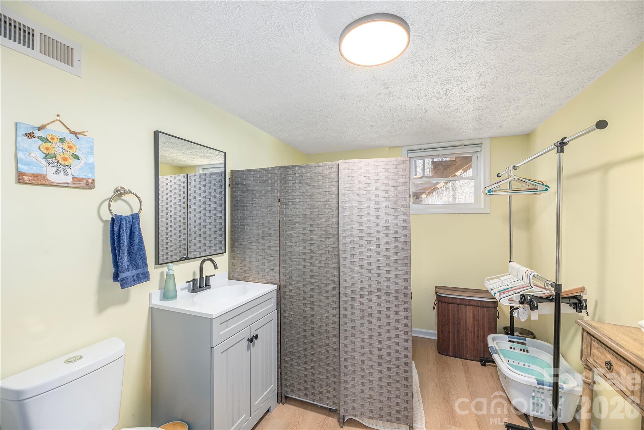 Laundry and half bath located on the lower level - 330 Woody Lane, Asheville