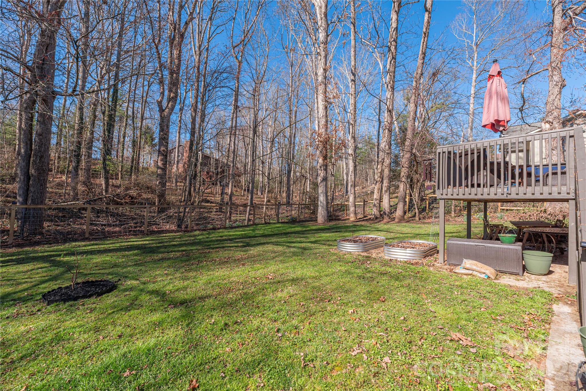 Back deck looking over the back yard and wooded area - 330 Woody Lane, Asheville