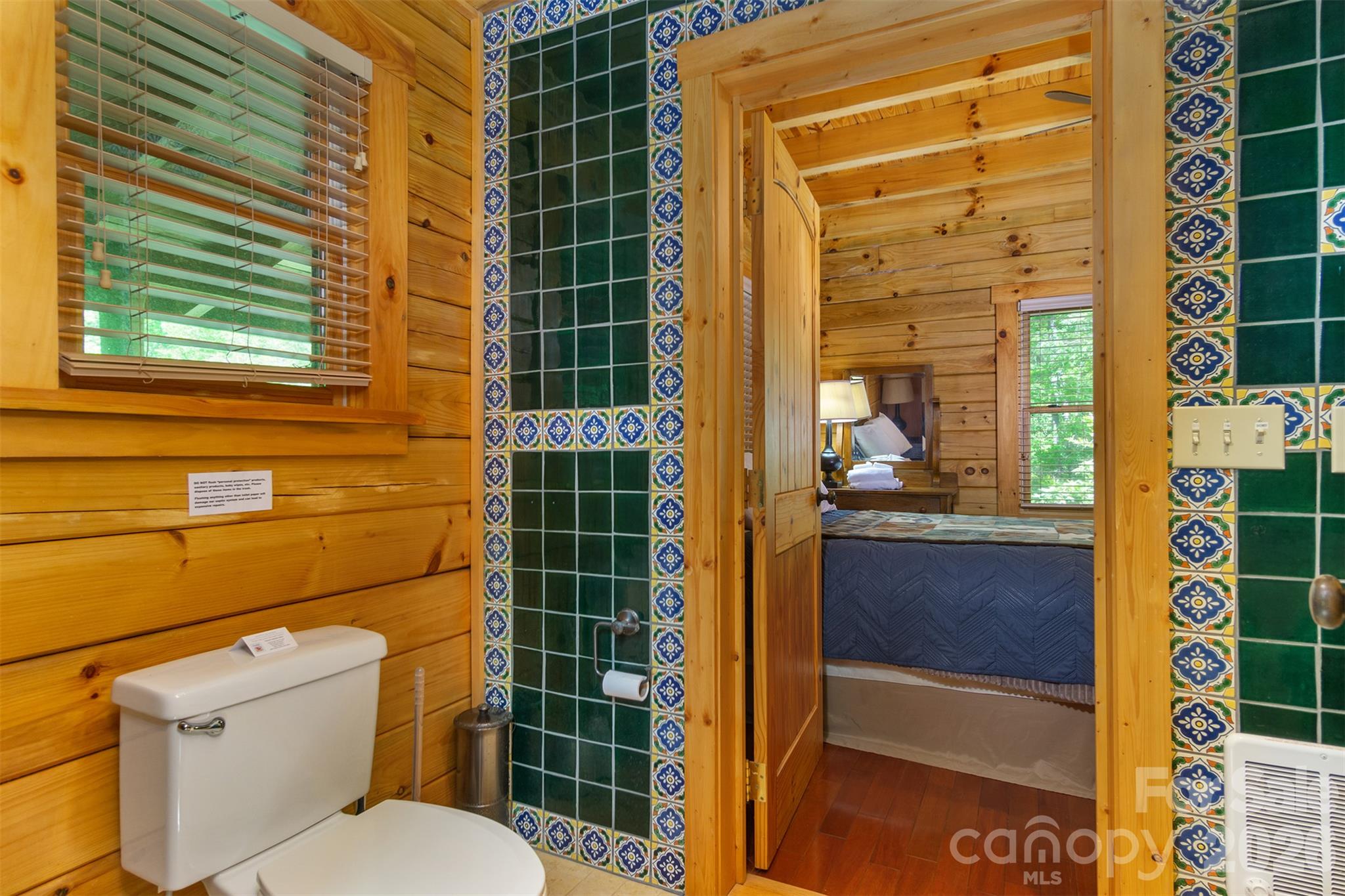Main level bathroom connects thru kitchen and main level bedroom. - 171 Camp Elliott Road, Black Mountain