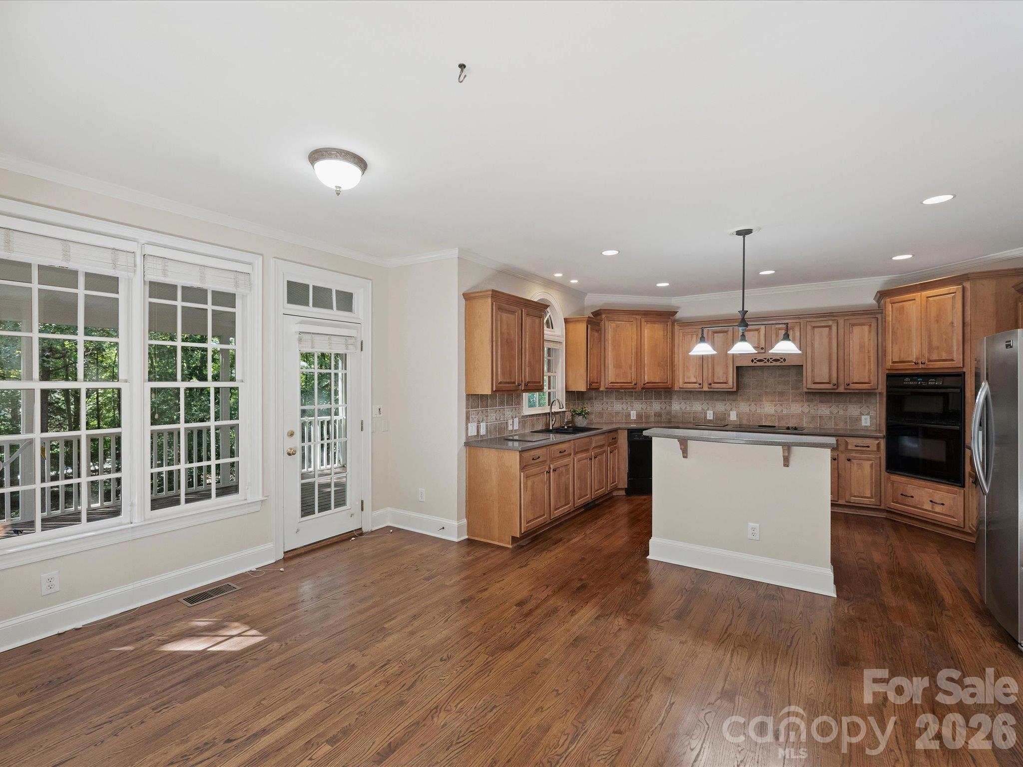 Eat-in dining area opens to screened-in porch - 7705 Stonehaven Drive, Waxhaw