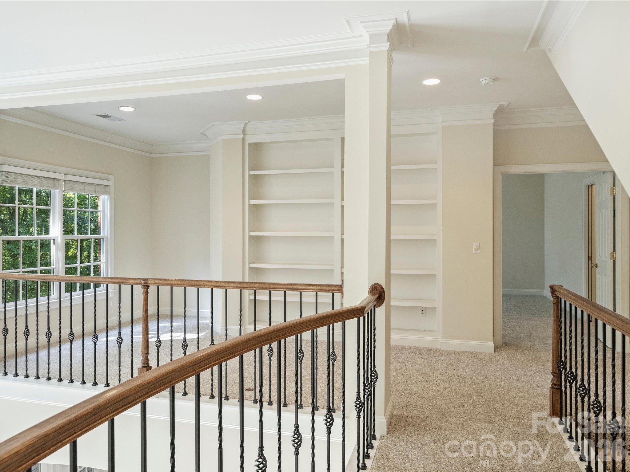Loft area upstairs has built-in bookcases - 7705 Stonehaven Drive, Waxhaw