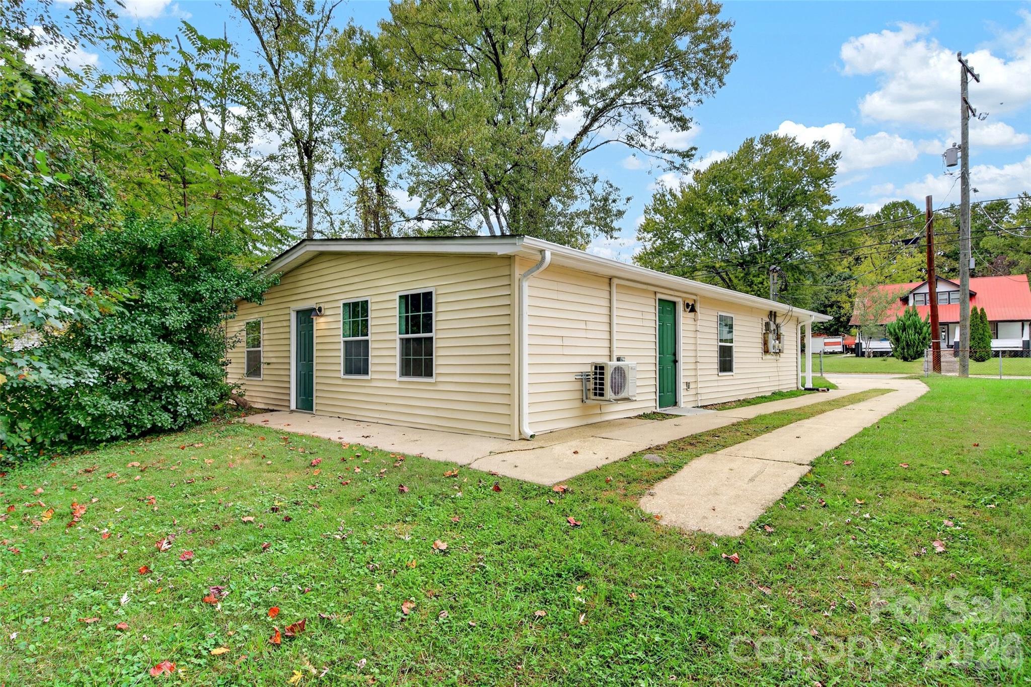 Rear and side view of detached garage with concrete floor. - 432 & 422 E Main Street, Old Fort