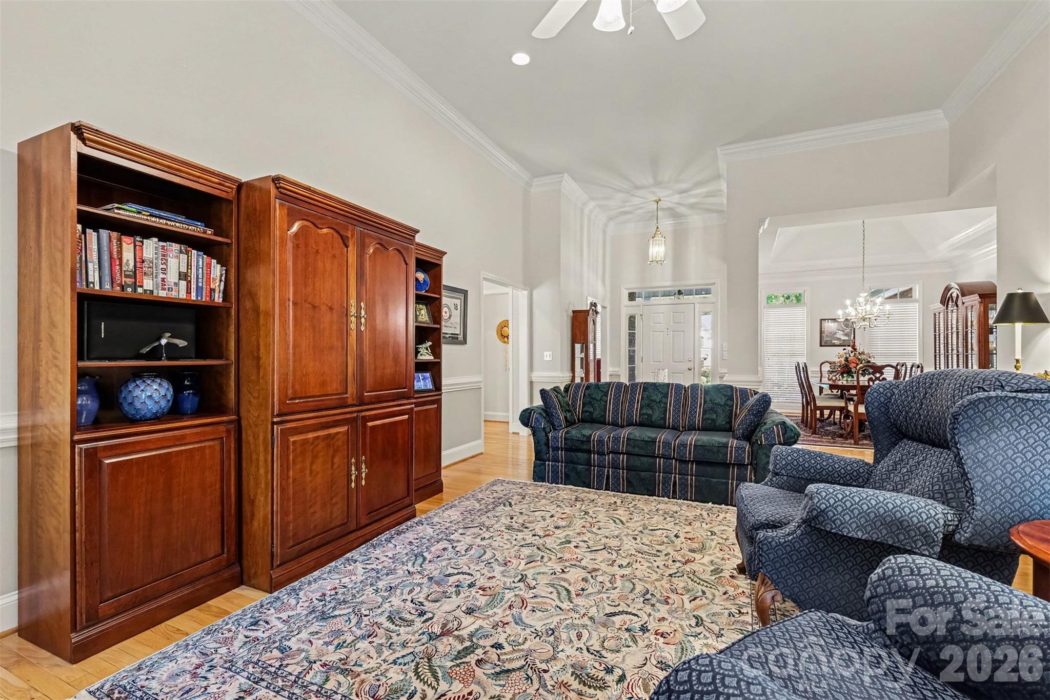 Great Room into the Foyer/Dining Room. Neutral paint, Hardwood Flooring. Check out that ceiling height!! - 8412 Locksley Drive, Harrisburg
